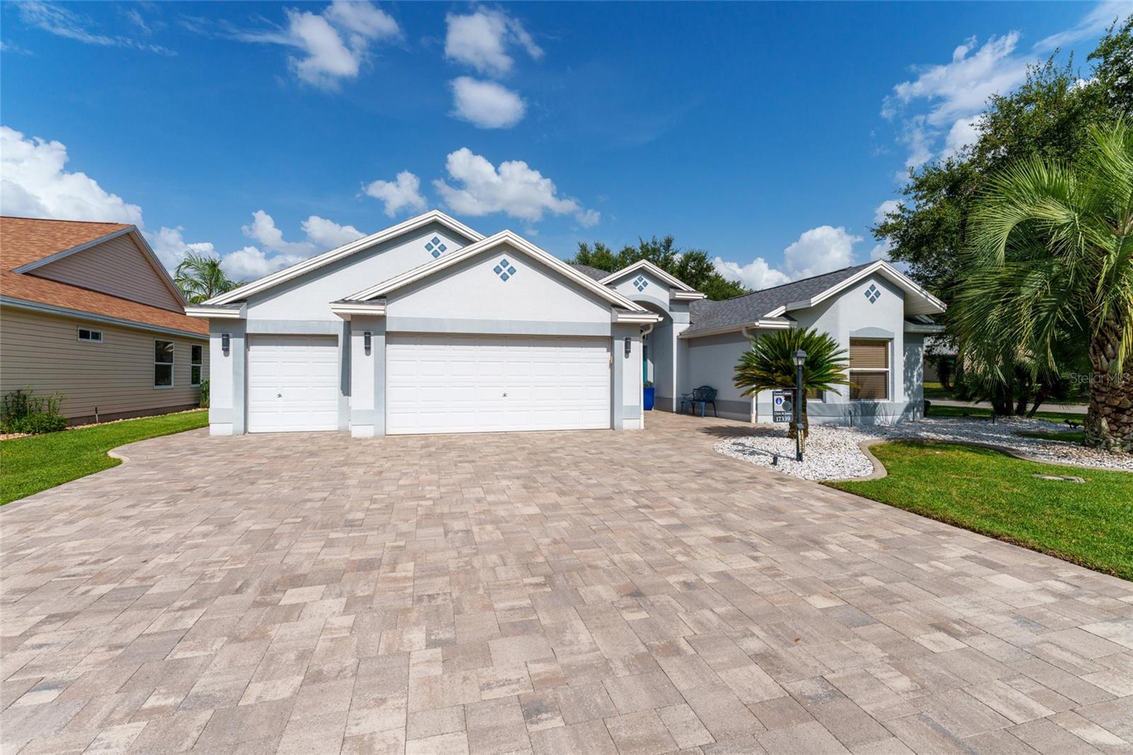 **BOND PAID!**Gorgeous 3-bedroom, 2-bath “LANTANA” model in Village of Chatham in The Villages® Florida. This stunning home has been completely UPDATED from Top to Bottom—Inside and Out offering a truly MOVE-IN READY experience. The redesigned OPEN FLOOR PLAN with kitchen "partition wall" removed to create SPACIOUS Kitchen/Living/Dining space. The tasteful renovations create a bright and generous living area centered around a MASSIVE QUARTZ ISLAND—perfect for entertaining. Enjoy beautifully updated laminate flooring throughout, sleek updated SS APPLIANCES including GAS RANGE, and modernized updated bathrooms with elegant walk-in showers. The split floor plan provides added privacy, with all three bedrooms boasting large, generous closets. Step outside to your PRIVATE PARADISE with incredible SALT HEATED POOL & SPA –installed 2021- ideal for year-round relaxation and entertaining. Inside Laundry with BUILT-IN PANTRY for added STORAGE. XL GARAGE w/ DOUBLE-DEPTH GOLF CART BAY, offering ample space for storage or hobby use. ROOF (2025), HVAC (2024), and HOT WATER HEATER (2021). This is a truly exceptional home that checks every box—don’t miss your opportunity to own a showstopper. NEW EXTERIOR PAINT COMING 2025 - Still Time to Choose Your Color!!