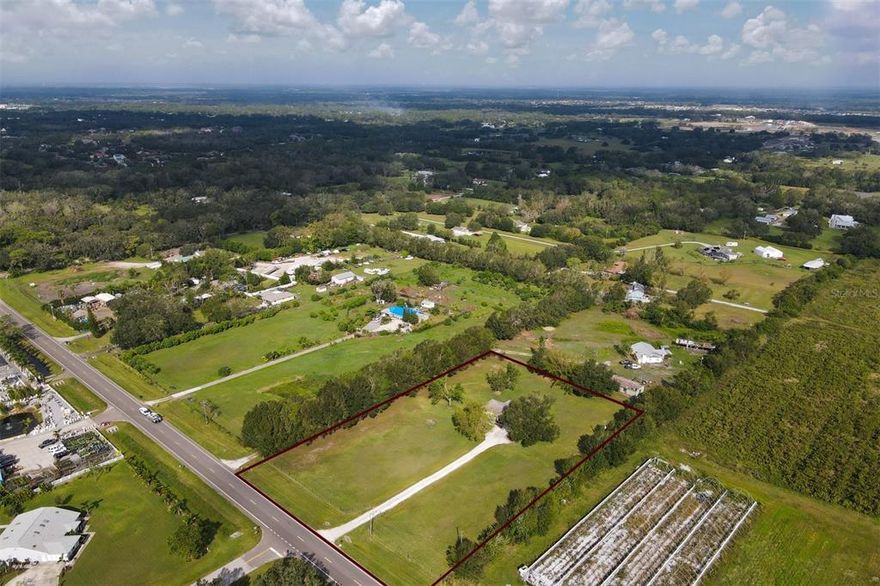 In the path of growth is a gorgeous high and dry parcel of 2.53 acres +/- with a 3 bedroom/2 bath home on SR 64.  Bring your animals and toys as this parcel does not have an HOA nor a CDD.  Build a barn for your animals or Boat and RV.  Zoned for horses.