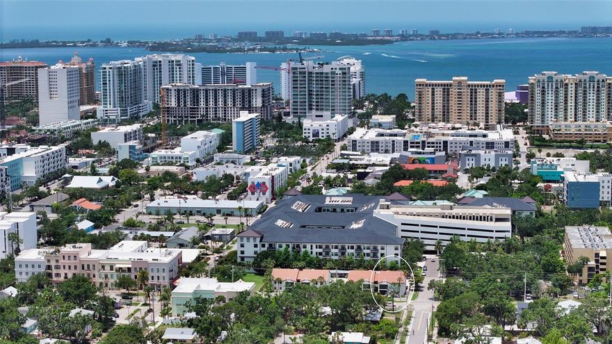 One or more photo(s) has been virtually staged. Discover unbeatable value in the heart of Sarasota’s vibrant Rosemary District. Unit #208 at Mentone Court is the only two-bedroom, two-bath condo downtown priced under $419,000—more than $40,000 less than the nearest comparable property. This fully renovated, second-floor corner residence combines affordability, location, and convenience in one exceptional package.

Located in a charming 16-residence community, this condo offers assigned covered parking, extremely low HOA fees, and minimal taxes—among the lowest in Sarasota. Featuring a smart floor plan with five closets, fresh tropical paint, and new recessed lighting, this light-filled retreat is move-in ready. Large porcelain tile flows throughout, complementing the newly updated kitchen with refinished solid-wood cabinetry, granite countertops, under-cabinet lighting, and a shimmering pearlescent backsplash. A breakfast bar and all-new stainless-steel appliances—including induction range, refrigerator, and dishwasher—enhance everyday living.

The spacious primary suite accommodates a king bed and includes a California-style walk-in closet. Both bathrooms have been tastefully updated—one with a cast-iron soaking tub and the other with an oversized tiled shower and stacked washer/dryer. Additional updates include a brand-new HVAC system, four remote-controlled Hunter ceiling fans, plantation shutters on all windows, and impact-resistant film for added peace of mind.

A 12-foot sliding glass door opens to the oversized screened lanai, complete with a motorized Kevlar hurricane shade rated for Category 5 storms. This top-quality system includes a battery backup and remote control, allowing you to use it year-round as a sunshade.

Low $522 monthly HOA fees cover water, sewer, trash, reserves, insurance, landscaping, and exterior maintenance. Professionally managed and fully funded, Mentone Court is solid block construction with a newer tile roof—outside the flood zone and exempt from new Milestone Inspection mandates. Rentals (one week minimum) and pets are allowed.

With a walk score of 92, you’re truly in a “Walker’s Paradise.” Step outside to Rosemary Court’s four restaurants, or stroll just five minutes to Main Street’s cafes, boutiques, and weekly Farmers Market. Whole Foods, theaters, and galleries are all nearby. For beach days, Siesta Key is a short drive, or hop on the Siesta/Lido trolley for easy access to Lido Beach every 20 minutes.

Offering new appliances, covered parking, hurricane protection, and the lowest downtown condo dues—Unit #208 checks every box for affordable Sarasota living. Perfect as a primary home, seasonal retreat, or investment, this is downtown Sarasota at its most attainable and convenient.