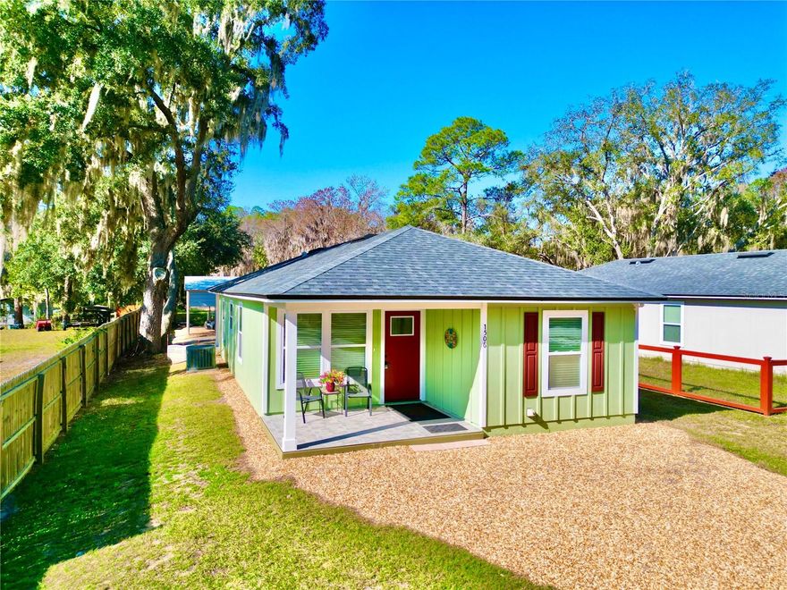 Rare Find on the Santa Fe Canal! This fully furnished, turn-key and freshly painted 3 bedroom, 2 bath home—built in 2021—offers 1,168 sq ft of heated/cooled living space with a bright open-concept design, ideal for entertaining indoors and out. The coastal-inspired interior showcases luxury vinyl plank flooring, granite countertops, shaker cabinetry, stainless steel range and hood, refrigerator, and a generous kitchen bar that flows seamlessly to the tiled patios, backyard, and 2-car carport. The split-bedroom layout features a primary suite with barn door entry, walk-in closet, and a stylish en-suite bath with glass walk-in shower. A brand-new washer and dryer are included. Outdoors, a fully insulated 10x10 shed with power and HVAC offers versatile storage space for a deep freezer and more. With direct canal frontage, a new fishing platform, and stairs leading to the water, you’ll enjoy easy access to Lake Santa Fe—one of Florida’s most renowned and the 3rd most stable lake in the state, which is a spring-fed lake; celebrated for year-round boating, fishing, and recreation. Schedule your tour today and start living the waterfront lifestyle!