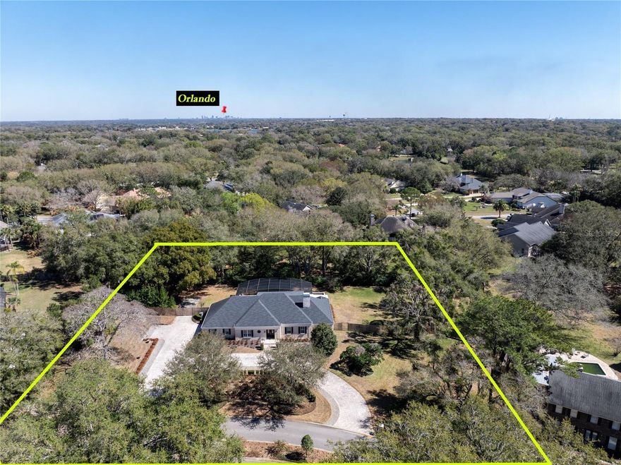 One or more photo(s) has been virtually staged. A rare opportunity in Windermere's established Lakes / Lake Down neighborhood — an exceptional builder's home offering the quality & finishes typically found at much higher price points. Set on a beautifully manicured ONE-ACRE LOT with BOAT ACCESS to the BUTLER CHAIN OF LAKES, this residence blends comfort, sophistication & the true Central Florida lake lifestyle. Homes offering this combination of space, craftsmanship & location seldom come to market — making this truly a one-of-a-kind opportunity within this intimate enclave of just 60 homes.

From the moment you arrive, the sweeping paver drive & circular approach framed by expansive lawn & mature landscaping create an inviting estate feel rarely found this close to downtown Windermere.

Inside, timeless details shine: solid birch hardwood floors, crown molding, designer lighting, recessed lighting throughout & classic plantation shutters adding polish & privacy. The open, light-filled kitchen & family room are designed for everyday living & effortless entertaining. The kitchen is a true gathering space featuring quartzite countertops, large wood island, farmhouse sink, polished gooseneck faucet with side sprayer, classic subway tile backsplash, wall-mounted pot filler, double ovens & an extra-wide side-by-side refrigerator. The spacious family room offers a built-in media wall & French doors opening directly to the lanai & pool for seamless indoor-outdoor living.

The PRIMARY SUITE ON THE MAIN LEVEL feels like a private retreat — spacious, serene & finished with plantation shutters, elegant lighting & room for a sitting area. The spa-inspired bath features dual vanities with vessel sinks, abundant storage, soaking tub & large walk-in shower with designer tile accents.

Upstairs, a generous loft/family room provides the perfect bonus space for movies, game nights, homework hub or second lounge, complete with impressive gray built-in bookcases. Secondary bedrooms are generously sized with ample closet space & en-suite baths.

Step outside to an unforgettable outdoor retreat: full screened enclosure & an expansive 60' x 12' COVERED LANAI — a truly massive extension of the living space. The RESORT-STYLE POOL & RAISED SPA are complemented by travertine decking with custom grid pattern & turf inlays, creating generous space for lounging, dining & entertaining — with room to add an outdoor kitchen if desired. Mature trees enhance privacy & tranquility.

And then there’s the showpiece backyard feature — a CUSTOM ELEVATED TREE HOUSE tucked among the trees. Designed with multiple windows, a charming wood door, circular staircase & tubular slide, this versatile retreat can serve as an art studio, workout space, creative office, homeschool room or unforgettable teen hangout — a rare feature that sets this home apart in the very best way.

Neighborhood amenities include tennis/pickleball court & private boat ramp to Lake Down connecting to the Butler Chain of Lakes.

Roof (2021), Water Heater (2026), A/C 2-ton (2018), A/C 4-ton (2016). Zoned for Thornebrooke (walking distance), Gotha Middle & Olympia High. Easy access to 429, Turnpike, 408 & downtown Windermere.