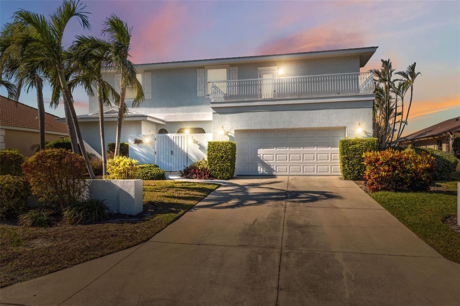 Exquisite Waterfront Luxury Home with Breathtaking Gulf Views nestled in the picturesque shores of Key Royale in Holmes Beach on Anna Maria Island. Welcome to an unparalleled coastal retreat in the exclusive North Point Harbor Community. This custom-built, 3,640 sq. ft. luxury waterfront estate boasts 4 full bedrooms plus a bonus room, 4 full bathrooms, and 2 half bathrooms downstairs, offering an exceptional blend of comfort and sophistication. Perched along the pristine shores of the Gulf, this POOL home offers immaculate water views from every angle, seamlessly blending indoor and outdoor living. Two expansive balconies provide the perfect setting for relaxation, while the private dock awaits your yacht, offering effortless access to Tampa Bay and beyond. Inside, you’ll find beautiful vinyl wood and tile flooring throughout the open-concept living spaces, enhancing the home’s refined aesthetic. Thoughtfully updated throughout, this residence features a durable, long-lasting metal roof, ensuring both style and longevity. Beyond the home, the North Point Harbor Community elevates your lifestyle with meticulously maintained grounds, tennis courts, and golf cart accessibility. Golf and boating enthusiasts will relish the proximity to the golf club and premier waterways, making every day feel like a luxury vacation. With no flood damage and an impeccable, move-in-ready condition, this waterfront masterpiece is a rare find. Don’t miss the opportunity to experience the ultimate in coastal elegance and resort-style living—schedule your private showing today!