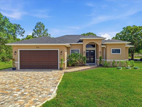 Photo of 810 Sentinela Boulevard, Lehigh Acres, FL 33974 (MLS # O6402108)