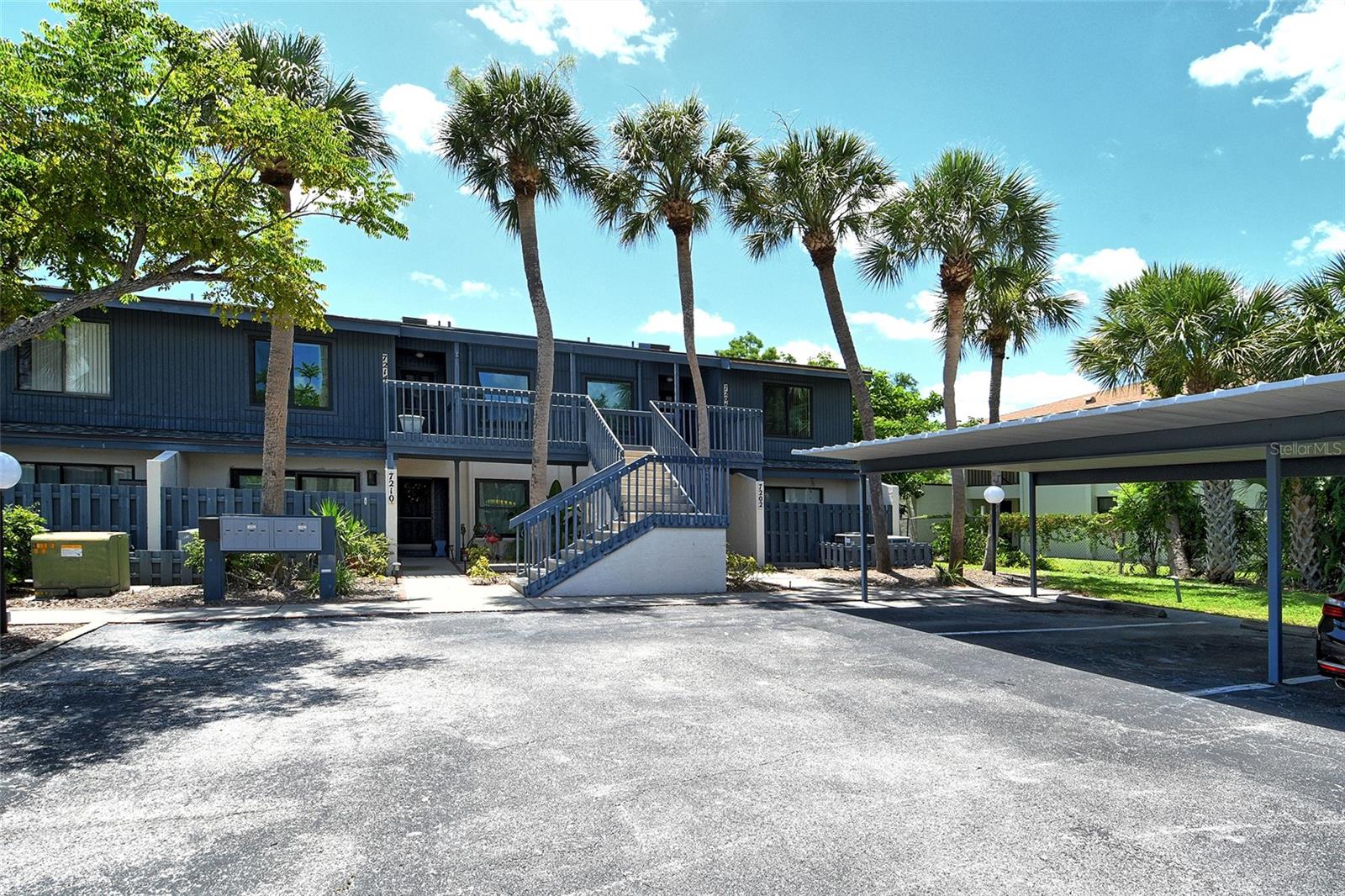 Lakeside Club of Sarasota, move-in ready! This spacious second-floor two-bedroom, two-bath condominium features vaulted ceilings and a large screened lanai overlooking a serene lagoon and preserve. The open-concept living and dining area flows seamlessly to the private outdoor spaces, creating an environment for relaxation and entertaining. Enjoy your morning coffee on the front patio and unwind in the fully enclosed back lanai with tranquil pond views and a manicured green lawn just beyond. Ideally in the desirable Gulf Gate area, just 12 minutes from the nation’s No. 1 beach, Siesta Key, this well-maintained home offers a blend of comfort and convenience. Recent updates include a new roof and skylights (2025), PGT hurricane windows on the east side, a new air conditioner with heat pump and water heater (2023), and a refrigerator replaced in 2025. The stackable washer/dryer and range are only five years old. Community amenities include tennis courts, a clubhouse, a refreshing pool and covered carport parking. You'll love the proximity to the new Gulf Gate Library, popular restaurants, shopping and everything Sarasota has to offer. Whether you're looking for a full-time residence or a winter retreat, this condominium is must-see. Schedule a showing today.