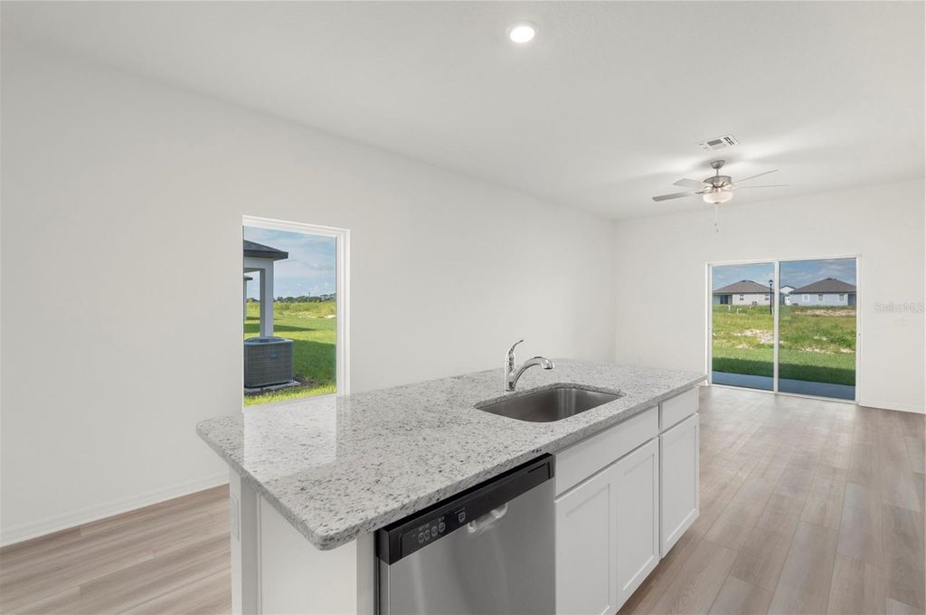 Photo of 3704 Bergamot Street, Lake Alfred, FL 33850 (MLS # TB8448399)