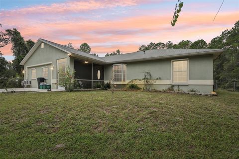 Photo of 1594 Papaya Street, Bunnell, FL 32110 (MLS # FC313054)