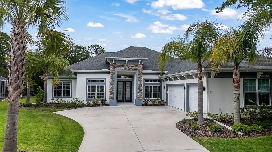 Welcome to this stunning 2023 custom-built smart home, offering 4 bedrooms plus a dedicated office, 3 bathrooms and just shy of 2,700 sq ft of thoughtfully designed living space. From the moment you enter, you’re greeted by soaring 10-foot ceilings, elegant coffered details and a bright, open-concept layout centered around a spacious living area with a custom-built fireplace. The split floor plan provides privacy and functionality, with generously sized bedrooms featuring large closets throughout. The entire home features tile flooring throughout, offering both style and easy maintenance. The kitchen and bathrooms are finished with sleek black granite countertops. The primary suite offers a luxurious retreat with a beautifully tiled walk-in shower, spacious vanity with two separate sinks, large soaker tub, and water closet. The laundry room is spacious, with a separate utility sink and a newer Samsung Washer and Dryer that convey with the sale of the home. The three other bedrooms are located on the opposite of the home. Bedrooms 2 & 3 share a bathroom, while the fourth bedroom includes its own private bathroom with direct access to the lanai, ideal for guests or future pool use.  Step outside to an oversized backyard providing added privacy and plenty of room to create your dream outdoor space. The home is already equipped with plumbing and electrical for an outdoor kitchen, as well as pre-plumbing and wiring for a future private pool. Additional highlights include an oversized 3-car garage and an extended driveway with a convenient turnaround for ample parking and ease of access. The garage attic is fully braced for storage and includes a 350 lb lift system. This home is loaded with smart and functional upgrades, including a smart sprinkler system with app control, surround sound wiring, a buried propane tank servicing the cooktop and a generator hookup for added peace of mind. A full gutter system is installed around the entire home. Located in a private community of just 48 homes, residents enjoy a private entrance, sidewalks, and low HOA dues of $327 quarterly. This move-in ready home combines modern design, quality construction, and future-ready outdoor potential in a highly desirable setting. Schedule your showing today to view this gorgeous home.