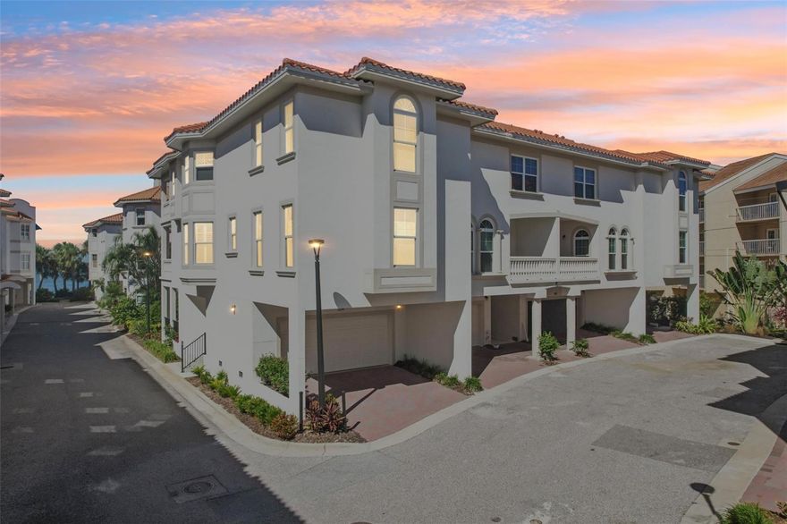 Experience modern coastal luxury in this stunning, FIRST TIME ON THE MARKET, 2023 townhouse in gated San Ruffino. This 3 bedroom, 3 bath, 2 car garage located in the heart of charming Dunedin was UNTOUCHED by 2024 Hurricanes and has been impeccably maintained by the original owner. This is upscale Florida living at its finest, every detail in this beautifully crafted residence speaks of elegance and style—from the warm gray designer palette to the luxury vinyl flooring that flows seamlessly throughout the home. As well as practical considerations like the elevator servicing from the 1st floor to the 3rd and expansive hurricane-rated windows and doors that are dressed with Hunter Douglas blinds, Plantation Shutters and custom Linen Drapes, offering both sophistication and privacy. The first floor is the garage, large deck to lounge and wave to your friendly neighbors and room for storage. Up to the second floor you'll find a bedroom and full bath, the living area and of course the fabulous kitchen. The gourmet kitchen is a true showpiece, boasting all High-End Fulgor Milano appliances, range is INDUCTION and CONVECTION, fabulous glowing quartz countertops complemented by a unique shimmery shell tile backsplash that adds that coastal flair. The top floor is where you will find the remaining guest bedroom and full bath as well as the Grand Primary bedroom that is spacious yet intimate with a WALK IN closet large enough to house your treasures and flowing into the stunning Spa-like bathroom with modern standing tub, dual vanities and oversized shower with floor to ceiling Carrera tile. Entertain in style or unwind in comfort with spacious living areas bathed in natural light. Or on three decks with WATER VIEWS. As well as the community POOL set ON THE WATER with PANORAMIC views of St. Joseph sound where you can relax and observe local wildlife like dolphins, manatees, flying fish, Pelicans, Osprey and so much more! This home is not just a place to live—it's a lifestyle. Ideally situated just minutes from downtown Dunedin’s vibrant shops, restaurants, and waterfront, and a short drive to Honeymoon Beach Park and Ferry to Caladesi Island, as well as half an hour from Tampa international. FLOOD INSURANCE NOT REQUIRED except lender may mandate a minor policy.