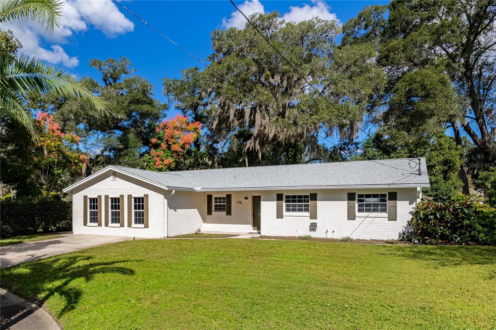 Welcome to 776 Mockingbird Lane in beautiful DeLand, Florida!  Nestled on a quiet cul-de-sac, this character-filled home has been lovingly updated from top to bottom and offers the perfect blend of charm and modern comfort. With 3 bedrooms, 2 bathrooms, formal living and dining rooms, a cozy family room, and a versatile bonus room that can easily serve as a 4th bedroom, home office, or playroom—you’ll have all the space you need to live, work, and play.  Step inside to discover a stunning new kitchen featuring quartz countertops, brand-new stainless steel appliances, stylish fixtures, and a sunny eat-in nook that’s perfect for casual meals. Freshly painted inside and out, the home feels bright and welcoming, with all-new lighting, hardware, and plush carpet throughout. Both bathrooms have been tastefully renovated with modern vanities and designer touches.  Outside, your private backyard retreat awaits! Enjoy the sparkling pool, basketball hoop, and a large storage shed—ideal for tools, toys, or hobbies. Plus, you’ll love the peace of mind that comes with a brand-new roof, new pool filter, new front door, and so many other updates.  Located near the water for boating and outdoor fun, and just minutes from airports, shopping, dining, and transportation, this home offers the best of both worlds—peaceful living with convenient access to everything you need. Full of warmth, style, and thoughtful upgrades, 776 Mockingbird Lane is truly move-in ready and waiting for you to call it home!