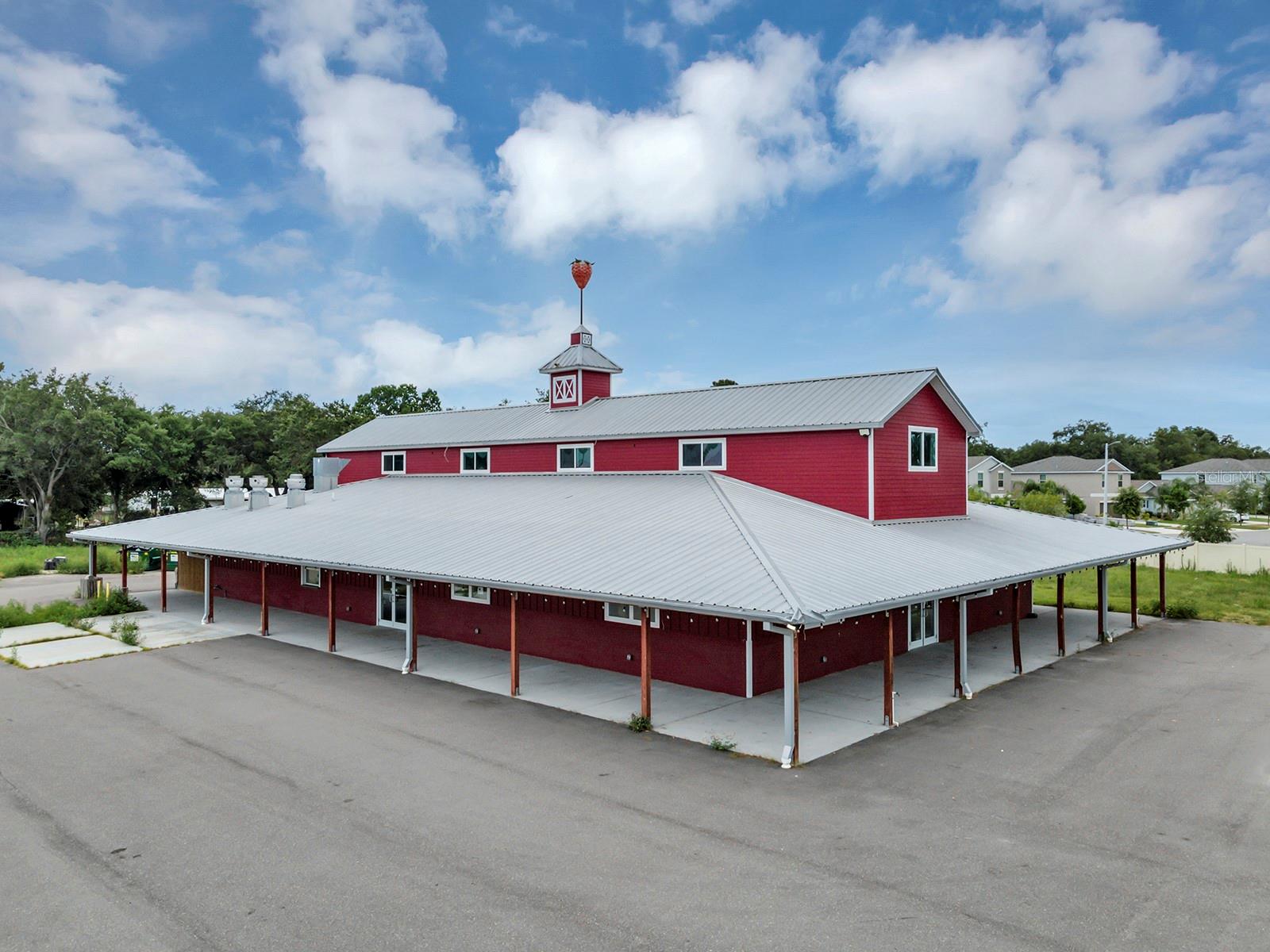 Located in one of the fastest-growing regions of Southeast Hillsborough County, 10070 Fern Hill Drive offers an exceptional opportunity. This property spans 3.74 acres MOL and features a prominent freestanding retail building with a total area of 8,000 sq ft. The first floor, which encompasses nearly 6,000 sq ft, boasts a large open space with a commercial kitchen, making it ideal for various uses, such as retail, dining, or event hosting. The second floor adds an additional 2,000 sq ft, including four private offices, open areas, storage, and two bathrooms.
Strategically positioned with high visibility from Gibsonton Dr (AADT 15,200), this property is perfectly situated for an owner user or redevelopment. The expansive land and prime location offer significant potential for future growth. For those interested in exploring this opportunity further, please contact us to schedule a private showing. This is an ideal chance to invest in a high-exposure property in a dynamic area of Riverview.