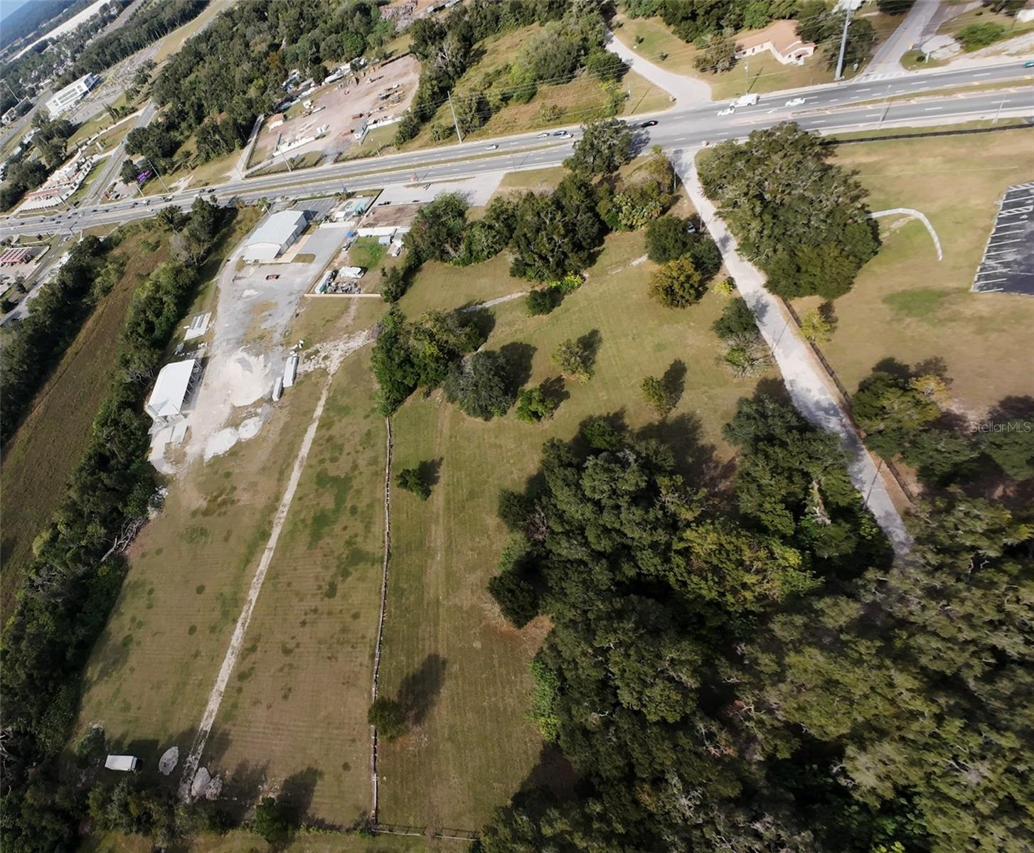 This property holds the rare B5 zoning at a prime location on HWY 27 not even a half mile east of I75. City water is available at site
and sewer connections are nearby. The median cut on HWY 27 allows ingress and egress from both traveling directions. The
property is dry and flat, ready to be developed by someone who requires the elusive heavy commercial zoning on a major highway.
Recent developments within half a mile of this parcel includes UF Health ER, Quality Inn, and Race Trac. Not to mention the plethora
of other commercial retailers and distributors within just a short drive down the road. First phase environmental available. Survey attached. Owner financing available. The possibilities are endless!