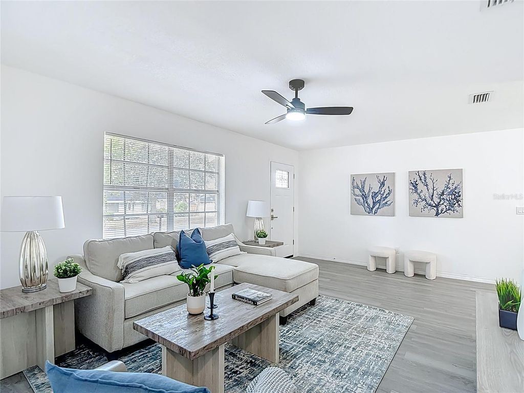 Photo of 10017 N Hartts Drive, Tampa, FL 33617 (MLS # O6364718)