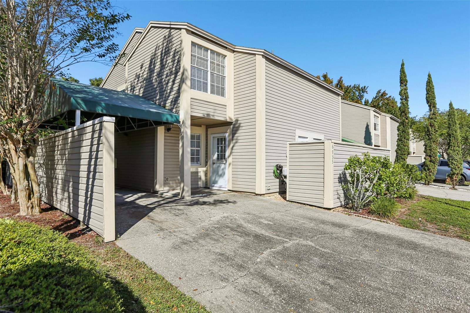 Enjoy a low-maintenance lifestyle in Lake Place, a gated community tucked away in Town 'n' Country. This townhouse style condo is unique from any other in the community! It has a neighbor on only one side allowing for wrap around views of mature landscaping & the lake, and it is situated directly across from the community mailboxes and recently updated swimming pool for ultimate convenience! Inside the home you will find many updates, including the gorgeous kitchen! The open floor plan allows for seamless interaction between the kitchen, dining room, living room and screened-in patio. Upstairs there are 2 bedrooms - each with its own updated bathroom. The primary bedroom has vaulted ceilings with a ceiling fan, an oversized closet and a balcony to enjoy more views of the lake and surrounding tree tops. The second bedroom has a large walk-in closet and ceiling fan. This home has a lot of storage space! Inside, there is a large storage closet on the second floor accessed from the hallway, and outside there is another large walk-in storage closet accessed near the driveway. The driveway has room for at least 2 vehicles including 1 covered parking space. Lake Place residents enjoy access to the lake including fishing & kayaking. No flood insurance required - located in Flood Zone "X." The monthly association fee for this unit is $561 and includes water, basic cable, exterior pest control, termite protection, exterior maintenance, exterior insurance, and landscaping maintenance. One pet per unit is allowed, including dogs 20 Lbs & under. New owners may lease their unit after 2 years of ownership. This community is located approximately a half mile from numerous restaurants, a Wal-Mart and a Publix. Tampa International Airport is about a 15 minute drive and downtown Tampa & the Channelside District are about a 20-30 minute drive away.