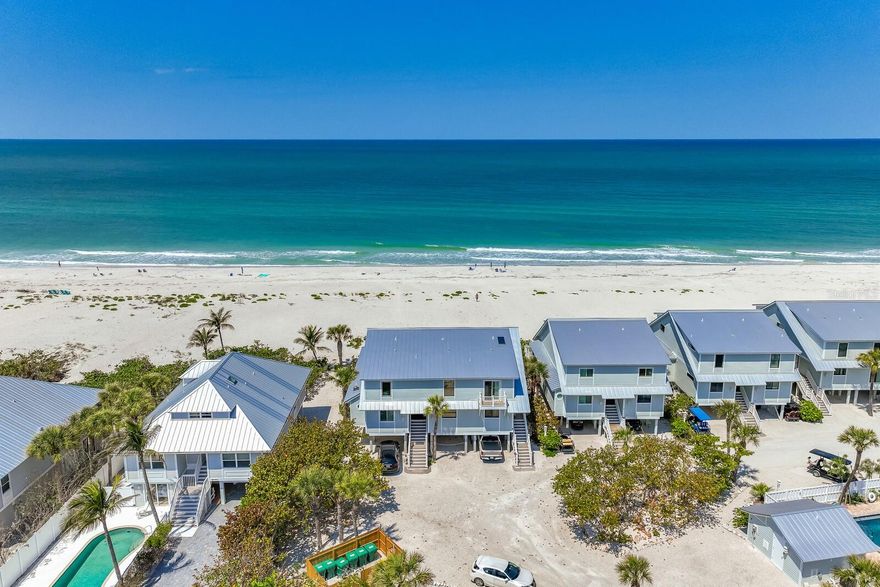 FANTASTIC BUYING OPPORTUNITY!  Enjoy Amazing Sunsets from this Beautiful Direct Beach front home on the Gulf of America!  This 3/3 Sea Grape Unit has been totally renovated and is being offered fully furnished and ready to go! Meticulously maintained and owner occupied, this home is elevated with parking and storage below for all your bikes and beach toys.  It features all the latest- including Hardiplank siding, and Impact glass, zoned AC, a large, elevated deck, plantation shutters, beautiful porcelain tile throughout, and an outdoor shower and shaded sitting area.  Pet friendly, low HOA fees and a tropical pool make this community extremely desirable!  At this price it is perfect for your first home on Boca Grande, an investment property or overflow for your family and guests! Call today for your private showing!