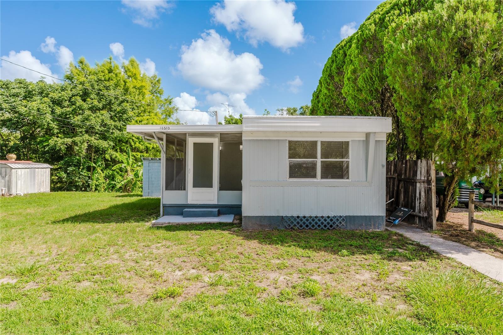 Fully Renovated 2-Bedroom Mobile Home in High-Demand Area of Ocklawaha
Discover this beautifully updated mobile home located in the heart of Ocklawaha, just minutes from the main highway. Situated in a high-demand area known for its residential appeal and close proximity to commercial centers and the region’s largest equestrian activity hub, this property offers both comfort and convenience.
This home features two private bedrooms and one modern bathroom. Enjoy the practicality of a separate, fully-equipped laundry room. The entire property has been tastefully renovated, boasting brand-new flooring, updated cabinetry, stylish sinks, a contemporary bathroom, and a fully air-conditioned interior.
The exterior includes a spacious yard and a separate shelter structure, perfect for storage or additional use. Whether you're looking for a permanent residence or a smart investment in a growing area, this move-in ready home checks all the boxes.