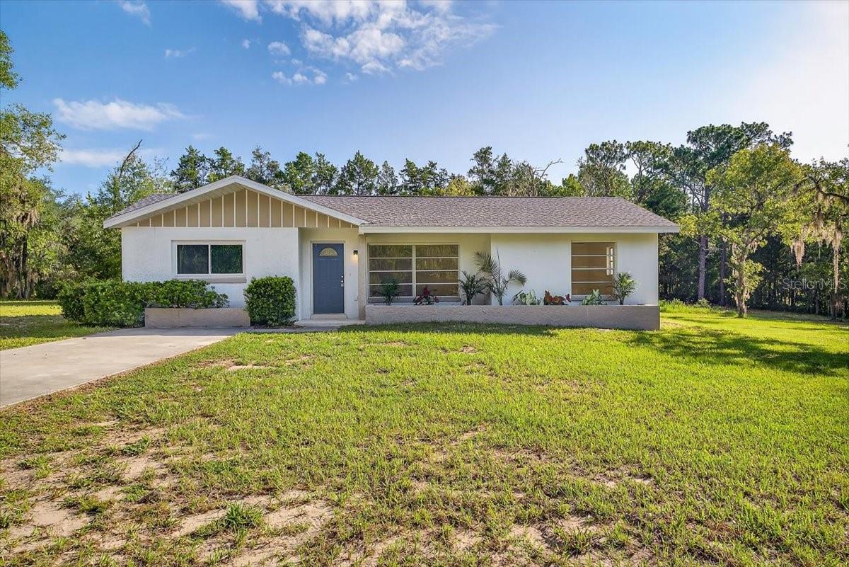 Gorgeously remodeled 3 bedroom/2bathroom home with a detached 1-car garage situated on 1.13 ACRES- located in the beautiful Rainbow Springs community! BRAND NEW 2025 ROOF. Walk inside to see a spacious living room that effortlessly flows into a dining area with a charming wood-burning fireplace. All NEW interior and exterior paint and new vinyl flooring throughout the entire home. ALL NEW kitchen featuring new cabinets, quartz countertops, new backsplash, and all new stainless-steel appliances. Multitude of NEW modern fixtures all new including ceiling fans, lights, and bathroom vanities. Sliding doors in the dining area open up onto a slap patio- perfect for lounging with a view of a HUGE backyard! Great split-floor plan. 2017 HVAC in good working condition. Schedule a showing now!