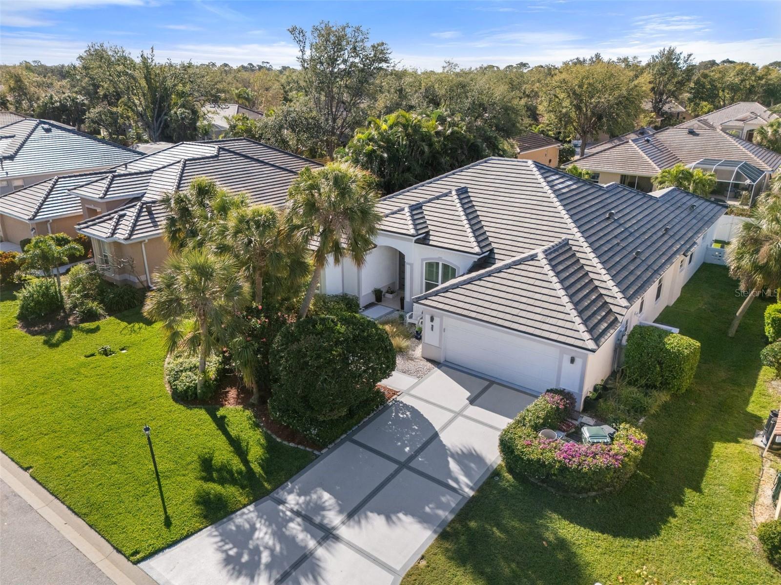 Welcome to this Impressive 4-bedroom, 3-bath pool home located in the highly desirable Park Trace Estates in Osprey, Florida — perfectly situated in a PRIME LOCATION between Sarasota, Nokomis, and Venice. Boasting over 3,000 sq. ft. under roof, this modern, updated ranch-style home is designed for indoor and outdoor living, featuring an open, split floor plan that flows seamlessly to the spacious screened lanai and pool area, perfect for entertaining or relaxing in privacy. Every detail has been thoughtfully upgraded, including a new modern flat tile roof, freshly painted exterior, new driveway, professional epoxy garage floor, sleek front entry doors, hurricane impact windows on front/east side of home, and a high-end efficient AC system. Close to Sarasota and Tampa/StPete Airports and quick access to I-75. Enjoy the best of Florida living with top-rated Blue Ribbon PINE VIEW SCHOOL, Oscar Scherer State Park, Legacy Trail, Siesta-Nokomis-Venice Beaches, and even a dog park just moments away! Because success should feel like a getaway—live the vacation lifestyle every day here at 826 Oak Briar Lane.