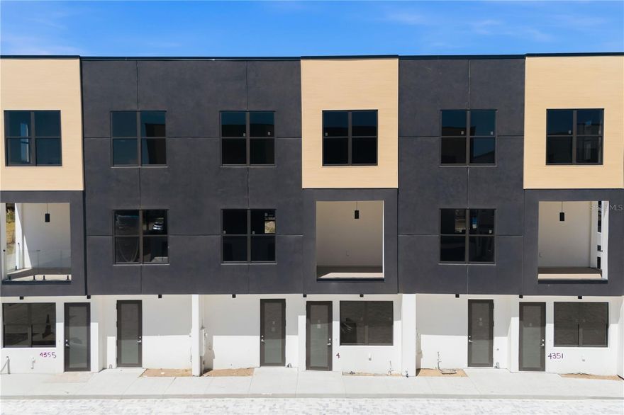 Model Valeria | Live/Work Townhome in Fontanarosa Village- By DANVA CONSTRUCTION. Welcome to Unit #4353, a residence within Fontanarosa Village, offering enhanced privacy, abundant natural light, and exceptional visibility—ideal for both residential living and professional use. This Model Valeria live/work townhouse features approximately 2,700 Sq Ft across three thoughtfully designed levels, with 3 bedrooms, 3.5 bathrooms, and 2 parking spaces, seamlessly blending modern design with everyday functionality. What makes this Unit truly unique is its integrated commercial space, designed for those who want to live and work in one efficient, stylish environment. The ground floor offers a fully dedicated commercial flex space, complete with a private entrance, office area, bathroom, kitchenette, and living/studio setup—perfect for client-facing businesses or a private professional workspace. The residential levels showcase high-quality finishes and thoughtful details throughout, including: • Fully equipped kitchen featuring stainless steel appliances, wood cabinetry with soft-close systems, and elegant quartz countertops • Elegant quartz countertops and wood cabinetry with soft-close system in all the bathrooms. • In-unit washer and dryer for added convenience • Bright open-concept living area with a private balcony off the second floor, filling the space with natural light • Spacious primary suite featuring a walk-in closet Ideal for: • Entrepreneurs, creatives, and freelancers • Attorneys, consultants, tax professionals • Boutique or service-based businesses (per zoning) • Remote professionals seeking a clear separation between work and home Key highlights of Unit #1: • Prime corner unit with enhanced exposure and light • True live/work design with independent commercial access • Fully approved mixed-use zoning • Cost-efficient dual-purpose ownership • Defined separation between business and private living spaces Residents enjoy quality construction and community design, including impact windows and doors, energy-efficient materials, paver driveways, landscaped grounds with irrigation, and private fencing for comfort and privacy- Fontanarosa Prime Tampa Location – Convenience Meets Lifestyle Situated in a highly accessible Tampa location, Fontanarosa Village places you within minutes of everything: • Downtown Tampa – approx. 20–25 minutes • Tampa International Airport (TPA) – 25–30 minutes • Clearwater Beach & St. Pete Beach – 35–50 minutes • Downtown St. Petersburg – 30–40 minutes Enjoy close proximity to major retail and dining hubs, including: • Dale Mabry retail corridor (5–10 minutes) • International Plaza & Bay Street (15 minutes) • Westshore Business District (15 minutes) Nearby attractions and recreation include: • Raymond James Stadium – 15 minutes • ZooTampa at Lowry Park – 12 minutes • Tampa Riverwalk – 20–25 minutes 4355 Townhouse is more than a home—it’s a flexible Urban lifestyle and investment, combining location, functionality, and long-term value in one of Tampa’s most promising growth areas.