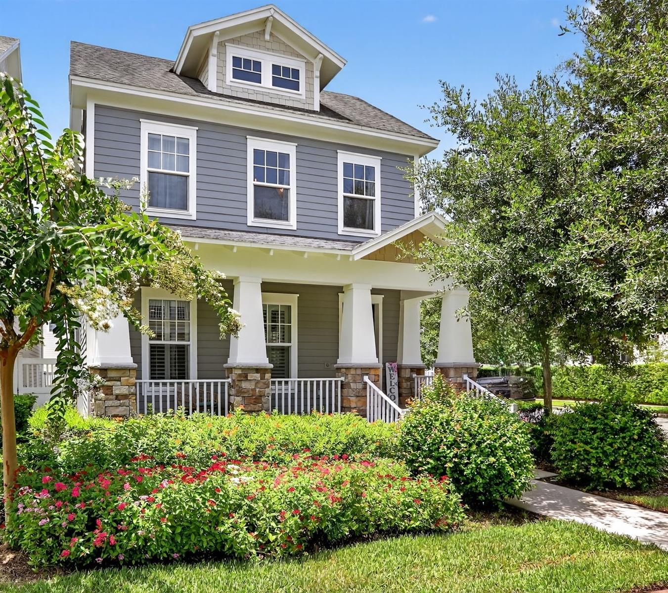 Step into this light-filled storybook fully updated 3-bed, 2.5-bath home in the heart of Celebration. Complete with a charming front porch perfect for relaxing evenings, positioned on a corner lot beside a peaceful mew, this residence offers a light-filled open layout. The main level boasts, a cozy and welcoming living room, dining room with gleaming hardwood floors. A French Provincial-inspired chef's kitchen with quartz countertops and stainless steel appliances, plus a private, fully fenced upgraded patio English garden -ideal for morning coffee or evening gatherings. Upstairs, a spacious loft, two guest bedrooms-each with walk-in closets and a stylish shared bath. The primary suite features a cozy sitting area, tray ceiling, spa-like bathroom with rainfall shower and pebble flooring, and a generous walk-in closet. Upstairs laundry room with extra cabinetry. Additional highlights include a first-floor powder room, large under stairs storage, an oversized 2-car garage with upgraded door and built in ceiling racks storage and ample room for bikes, tools, or a workspace. This home also includes crown moldings, plantation shutters, upgraded flooring, and a freshly painted exterior. Located in Celebration, a vibrant community known for its small-town charm, scenic trails, parks, pools, dining, shopping, and seasonal events all just minutes from Orlando's top attractions. Don't miss your chance - schedule your private showing today!