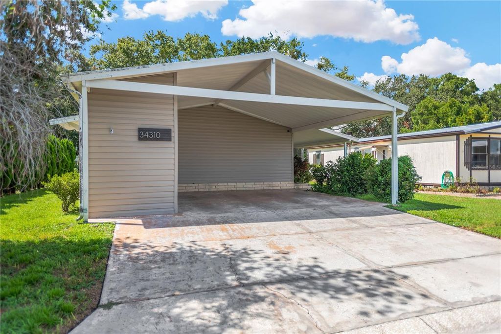 Photo of 34310 Lodge Drive, Wesley Chapel, FL 33543 (MLS # TB8421342)