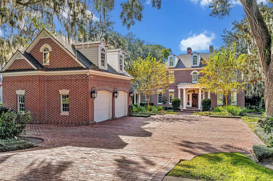 Enjoy your private lakefront retreat in one of Winter Park's most exclusive neighborhoods on Lake Mizell, just a short walk from Rollins College and Park Avenue's restaurants and shops.  This spacious 6-bedroom, 7-bath home features gorgeous views of the lake from formal living and dining rooms, a large primary suite, and several other areas of the home. A large bonus room with a full bath over the detached garage is perfect for a potential guest house. Amenities include an open foyer with marble floors, hardwood dining and living room floors, and plantation shutters and and detailed crown molding throughout. A gourmet chef's kitchen includes island seating for 6, as well as a large dine-in area overlooking the pool and lake. The kitchen includes a warming drawer, subzero refrigerator, dual dishwashers, a 6-burner Wolf gas stove, 3 sinks, and granite countertops. A large family room is adjacent to the kitchen, while a roomy office includes stately finishes and built-ins, including a murphy bed. The first-floor primary suite includes a sitting area with beautiful water views, two large walk-in closets, and a bathroom with dual sinks, a large shower, and separate soaking tub. Upstairs are 5 bedrooms, 1 ensuite and 4 with shared Jack and Jill bathrooms. Another large bonus room could be converted into a workout room, and the house includes both an upstairs and downstairs laundry room. This 6,115 square foot gem on a .62-acre lot off Genius Drive is an unparalleled quiet, tranquil lakefront oasis in the heart of old Winter Park. In addition to the beautiful large swimming pool, the lakefront side includes a boat house with electric hoist. Bedroom Closet Type: Walk-in Closet (Primary Bedroom).