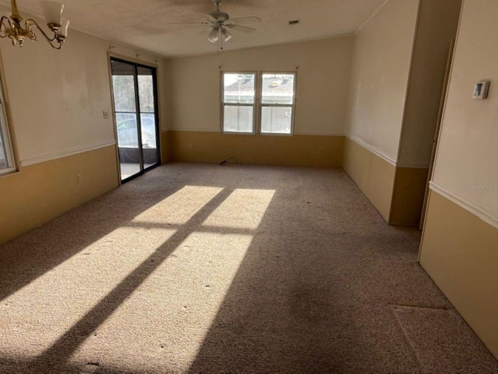 Photo of 1832 W Schwartz Boulevard, Lady Lake, FL 32159 (MLS # OM715948)