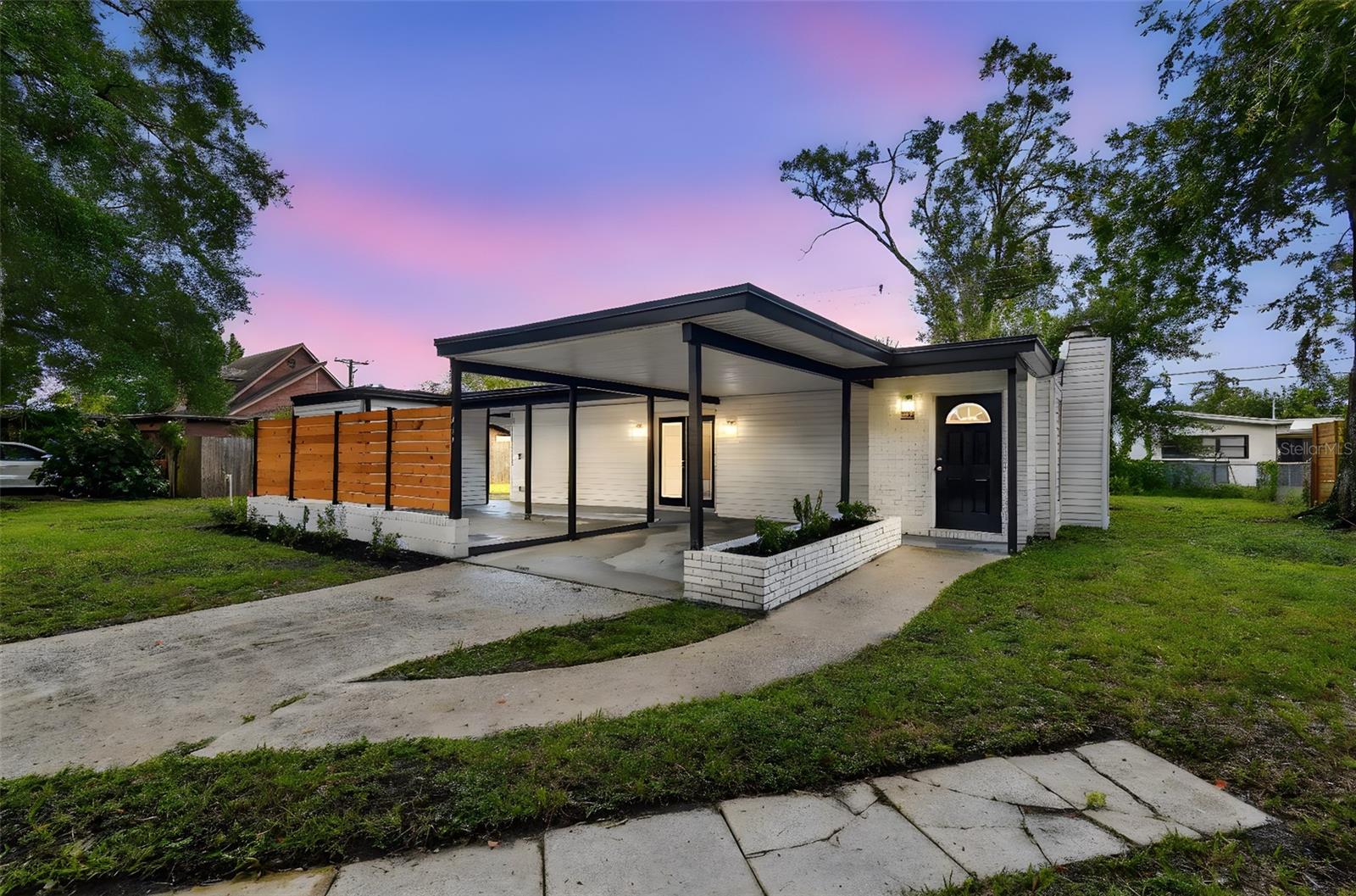 TEMPLE TERRACE - Step into timeless style with this 3-bedroom, 2-bath Mid-Century Modern home. Recently remodeled from top to bottom - featuring a brand-new roof, clean lines, open-concept living, and windows that bring in abundant natural light Updated kitchen: This chef's dream boasts sleek quartz countertops, modern appliances, and ample cabinet space - perfect for preparing meals and entertaining guests. Updated bathrooms. Energy efficient LED lighting throughout. Relax and Enjoy a private deck. Polished Terrazzo flooring throughout. A perfect blend of classic design and modern convenience—don’t miss this move-in-ready MCM beauty!