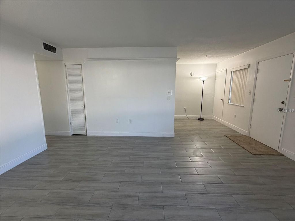 Photo of 1235 S Highland Avenue #1-102, Clearwater, FL 33756 (MLS # TB8481760)