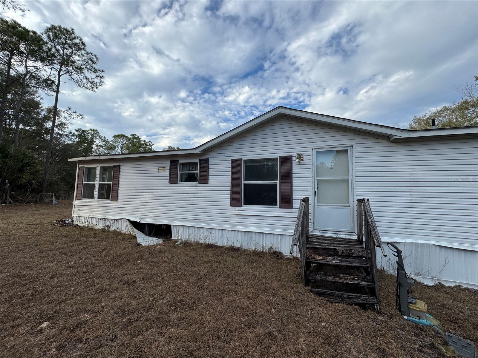 Lovely home 3 bedrooms 2 bath mobile home along with over 10 acres lot. Home is in need some repairs.