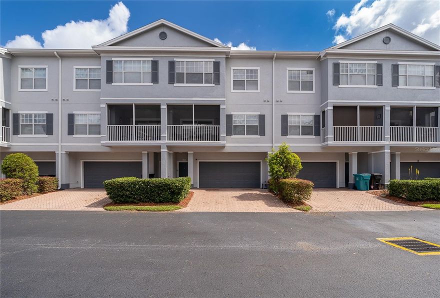 Modern living in a prime Orlando location. This spacious 2-bedroom, 2 and half bath townhome is ideal for those seeking comfort, privacy and convenience just minutes from Millenia Mall, Universal theme parks, Downtown Orlando and major highways. Thoughtfully designed with separation in mind, the home features all living areas on one level and both bedrooms on another, creating the perfect balance between entertaining and personal space. The open concept kitchen, dining and living area is filled with natural light and seamlessly connects to a private screened in balcony, making it ideal for hosting or unwinding after a long day. The kitchen offers contemporary finishes including granite countertops, backsplash, stainless steel appliances and ample cabinetry, while the bathrooms have been updated. A custom TV wall with TV and sound system is also included, adding style and functionality to the main living space. Enjoy the convenience of an oversized 2 car garage with additional driveway parking, plus the ease of HOA covered exterior maintenance, including a roof replaced in 2021 and exterior painting completed in 2025. High-speed 1GB Spectrum internet is also included, simplifying your monthly expenses. Located within the 24/7 guard gated community of Park Central, residents enjoy resort style amenities including pools, fitness center, sports courts, on-site dining, and scenic walking paths. A perfect blend of space, privacy and location designed for the way you live today.