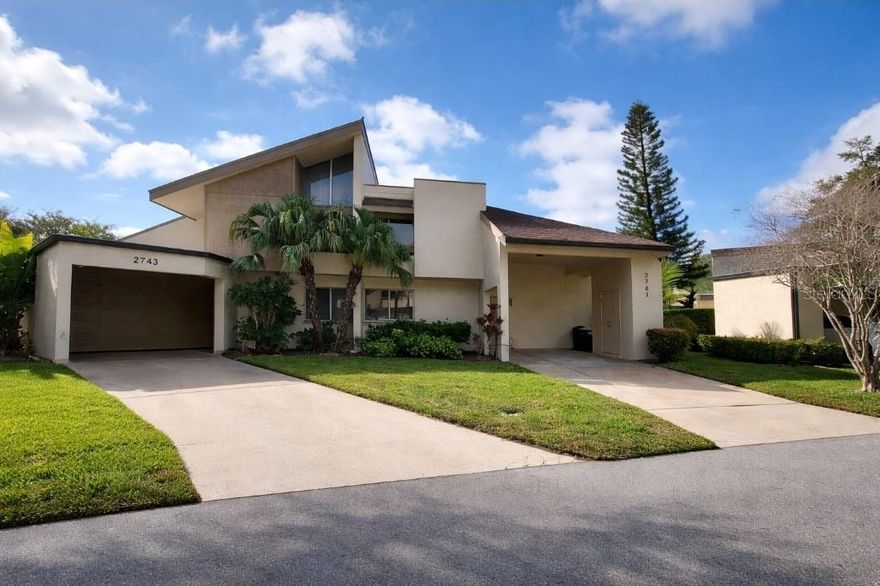 Largest floorplan in Winding Wood and rarely available, this fully UPDATED 4-bedroom, 2-bath townhome offers approximately 1,800 sq ft of beautifully renovated living space on a quiet cul-de-sac in Clearwater’s highly desirable Countryside area. Surrounded by expansive open green space, this residence delivers uncommon privacy and scale within the community. Huge bonus – the pool is a short walk from the unit. For most of Winding Wood it is a very long walk or you’ll need to drive and park, and there is no pool parking. Every major system has been UPDATED including NEW AC system, NEW water heater, NEW electrical panel, UPDATED plumbing in kitchen and baths, NEW dishwasher, NEW microwave, NEW stove, NEW carpeting in all bedrooms, NEW vanities and toilets, luxury showerheads, UPDATED fixtures throughout, and professionally re-enameled bathtubs. The entire interior including walls, baseboards, and railings has been freshly painted with high-quality paint. The home has not been lived in since renovations were completed and is truly move-in ready. The main living area features a dramatic 20-foot vaulted ceiling creating an open, light-filled space. The first floor includes a large bedroom with a full bath nearby, ideal for guests, flexible living, or office space. The kitchen features custom maple cabinetry and solid one-inch granite countertops. Sliding glass doors open to exceptionally large private outdoor areas enclosed by six-foot walls, offering complete privacy and ample space for entertaining, outdoor dining, or gardening. The tiled patio enhances the indoor-outdoor connection. Generous storage includes space under the stairs and additional storage within the semi-enclosed covered parking structure providing excellent vehicle protection and easy access. Upstairs includes a spacious primary bedroom with sliding glass doors, a full bath, and two additional bedrooms. All closets, including the walk-in off the primary bedroom, feature custom built-in wood shelving. Countryside offers immediate access to dining, shopping, a major indoor mall, grocery stores, theaters, parks, and recreation while remaining set back from heavy traffic in an established residential setting. Tree-lined sidewalks extend nearly a mile, the Pinellas Trail runs parallel to the community, and the Gulf beaches including Clearwater Beach are approximately 20 minutes away. Fully UPDATED, exceptionally positioned, and rarely offered in this size, this is one of the strongest opportunities currently available in Winding Wood.