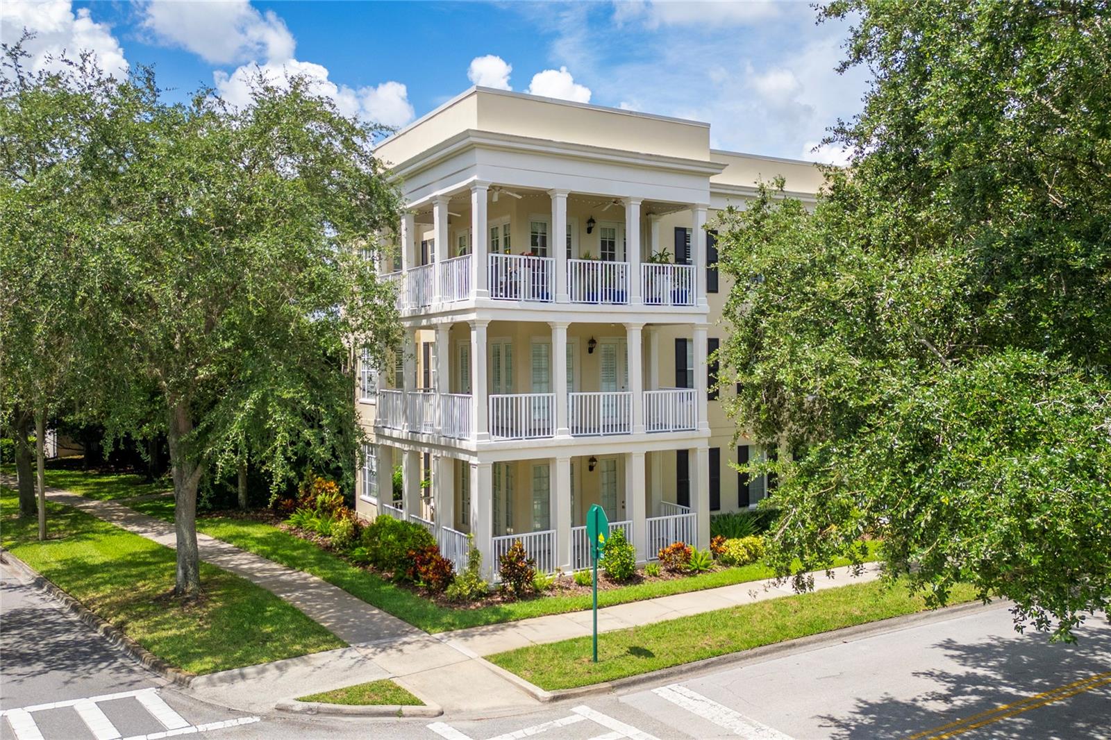 **Rare opportunity to own in South Village, Celebration** Welcome to this beautiful and well maintained 3-bedroom, 2-bath condo in Celebration’s desirable South Village. With 1,406 square feet this home features a spacious open floor plan filled with natural light, large balcony and elegant crown molding. Enjoy the recent upgrades, including a luxury vinyl floors, new A/C, appliances and remodeled master bathroom completed in 2024. As a top-floor penthouse, you’ll experience ultimate privacy with no neighbors above. The large wraparound balcony, complete with ceiling fans, overlooks beautiful mature trees, creating a tranquil outdoor retreat. The building is equipped with an elevator for easy access, and the unit includes a private one-car garage along with a parking pad directly in front of the garage—providing parking for two cars. Located adjacent to Spring Park’s pool, playground, athletic field, and Heritage Hall, you’ll have recreation and relaxation just steps from your door. This is a Fannie Mae approved condo, allowing for conventional financing options, and offers the advantage of a condo fee that include trash/recycling and water/sewer. Inside, the spacious open floor plan and modern finishes provide comfortable living, with the added convenience of in-unit laundry and ample storage. Living in central South Village means enjoying Celebration’s exceptional amenities, including playgrounds, tennis courts, soccer fields, dog parks, multiple pools, fitness centers, indoor and outdoor event spaces, passive parks, an extensive boardwalk and trail system. You’re also close to the lively Celebration Town Center, with its year-round schedule of community events, shopping, and dining. For added everyday convenience, the brand-new Celebration Pointe shopping center—with a Publix and a variety of additional shops and services—is just a short drive away. Don’t miss this opportunity to live at Celebration’s South Village—one of Central Florida’s most vibrant communities.