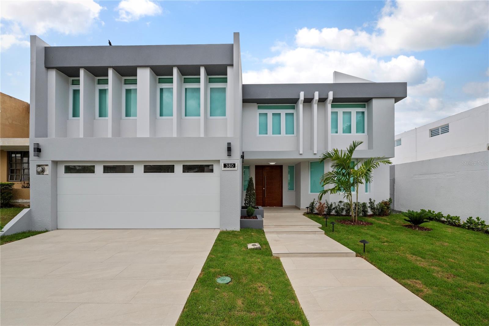 Experience comfort, style, and convenience in this beautifully renovated home, located on a quiet street in the gated community of Villas Reales in Guaynabo. Remodeled in 2025, this bright and spacious property offers modern living with thoughtful touches designed to suit a variety of lifestyles.
With approximately 2,700 square feet, 4 bedrooms, and 3.5 bathrooms, there’s plenty of room to relax, work from home, or entertain. The open layout is filled with natural light, creating a warm and inviting atmosphere throughout. The primary suite offers peaceful views of Guaynabo and features a brand new walk-in closet and an elegantly updated en-suite bathroom.
Everyday living is made easier with practical features like a fully equipped kitchen, laundry area, air conditioning in every room, a generator, water cistern, and a spacious two-car garage. For added convenience, there's also a second refrigerator on the upper level—perfect for storing quick snacks or drinks. Step outside to a covered terrace and outdoor deck where you can enjoy your morning coffee or unwind at the end of the day while taking in the view.
As a resident of Villas Reales, you’ll have access to a range of amenities including a pool, tennis and pickleball courts, clubhouse, and a playground. The location also puts you just minutes from top private schools, shops, and restaurants.
Whether you're starting fresh, relocating, or simply looking for a peaceful and secure place to call home, this beautifully renovated property is a must-see. Be the first to enjoy it!