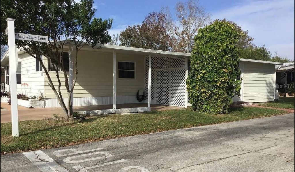 Photo of 340 Windsor Drive, Port Orange, FL 32129 (MLS # V4944560)