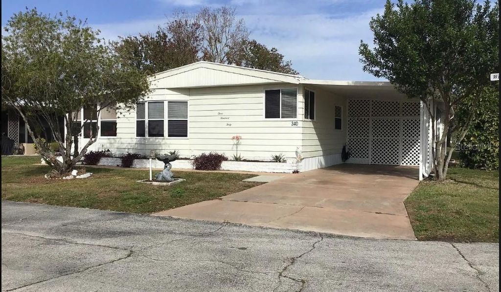 Photo of 340 Windsor Drive, Port Orange, FL 32129 (MLS # V4944560)
