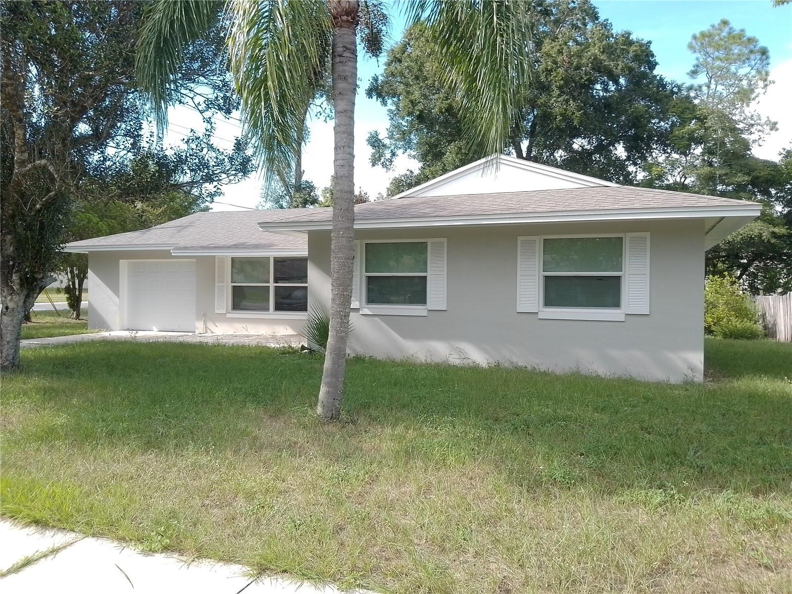 You won't want to miss this beautifully updated 3-bedroom, 2-bath home just minutes from downtown Eustis and Mount Dora! Easy commute to Orlando with the many new ways to reach the 429! This cozy home features a new roof, A/C, windows, sliding doors, garage door, bathrooms, and fresh interior/exterior paint—all completed for comfort and peace of mind. Located in a well-established neighborhood with no HOA, the property offers a spacious yard and easy access to nearby shops, restaurants, and parks. Granite counter-tops in the kitchen and baths, ceramic tile throughout, large open living space, and an extra storage closet in the hallway. This beautiful block home is ready for a new owner! Call today for your private tour!