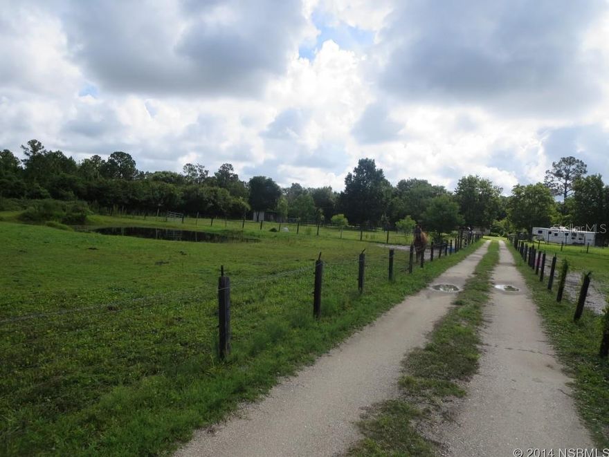 This peace of land is a must see. There are currently 7 horses being boarded there at $125.00 a month each. Also there is a home on the property that is an extensive need of repairs. There are 4 barns on the property. Easy to see.