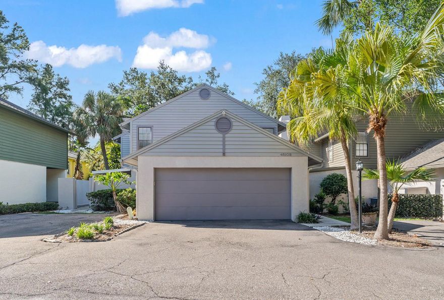 One or more photo(s) has been virtually staged. Stunning, fully updated home in the highly desirable Westshore Palms Area! Bretton Woods is a charming neighborhood with 10 homes, lush landscaping, and a community pool. This home was recently updated in 2022 and it shows! The first floor has an open kitchen with quartz countertops, dining area, living room with TWO STORY CEILING, fireplace, engineered hardwood flooring, and two car garage. The first floor primary suite is spacious, has high ceilings, walk-in closet with built-ins, electric fireplace, and entry to the backyard (convenient for pet owners). The ensuite primary bathroom features a dual head/dual valve shower, double sink vanity, and LED mirror. Upstairs you'll find a loft area, updated bathroom, and two more spacious bedrooms, both large enough for king beds. The outdoor space includes two covered lanais, backyard with new sod and landscaping, irrigation, and a deck off the primary suite. AC's are 2020 and 2018, and roof is 2017. Bretton Woods is a condo community with 10 stand alone homes - the best of both worlds. The condo fee covers exterior insurance, water, trash, landscaping, and pool maintenance, making this a stand alone home with low maintenance. Truly a unique property in South Tampa. Location is near TPA airport, Westshore and International malls, new and classic restaurants, and accessible to I-275 exit. Furniture is available upon request.