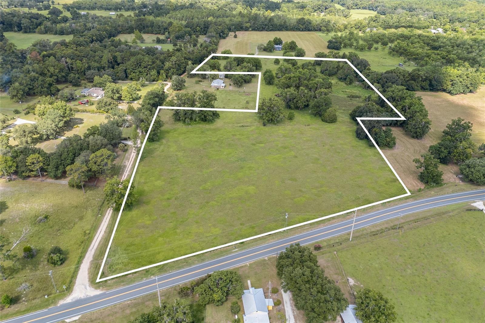 Expansive 13+ Acre property located just 2 Miles south of Melrose, FL! Discover the rural serenity and convenient access to Gainesville, Palatka, and Keystone Heights. Zoned for agricultural/residential use and located just 2 miles from the charming town of Melrose, this sprawling property offers endless potential for your dream home, family estate or farm. Surrounded by lush natural beauty and scattered trees, this peaceful area provides the ideal location for those seeking privacy, space, and the tranquility of country living while still being within easy reach of shops, restaurants, art galleries, and the scenic lakes that make Melrose a beloved local destination. Don’t miss your chance to own a piece of Florida’s untouched beauty.
