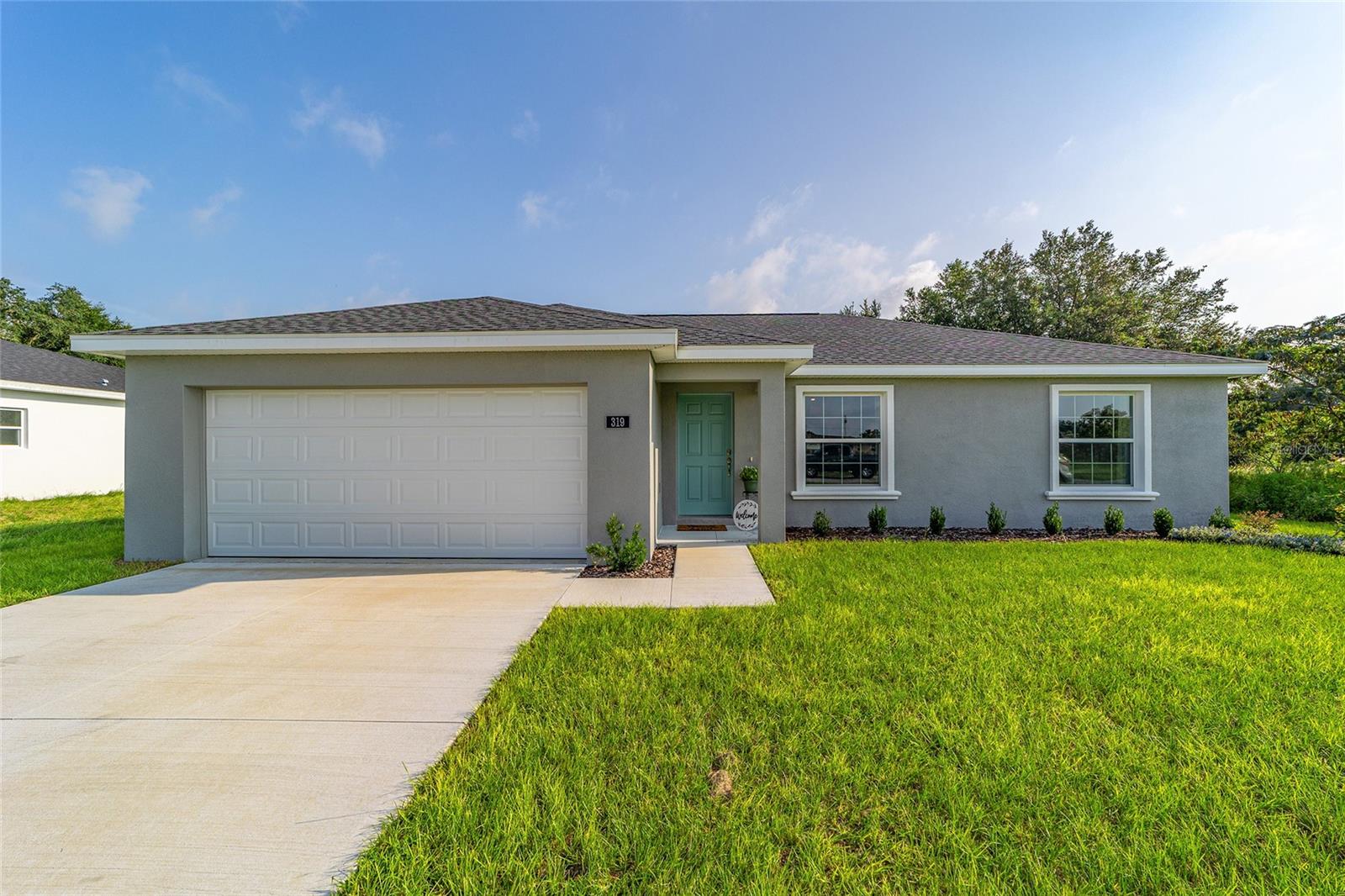Beautiful NEW construction home in desirable SW Ocala neighborhood, completed and move in ready. Nice lot with 3 bedrooms, 2 baths in an open concept split floor plan. Home features great curb appeal, granite counters, real wood cabinets, stainless steel appliances, luxury vinyl plank throughout, ceiling fans, upgraded light fixtures. Master suite with WIC and private bath with tiled shower. Landscape package, inside laundry, and 2 car garage. Pictures, photographs, colors, features, and sizes are for illustration purposes only and will vary from the homes as built. Builder has other similar homes available as well.