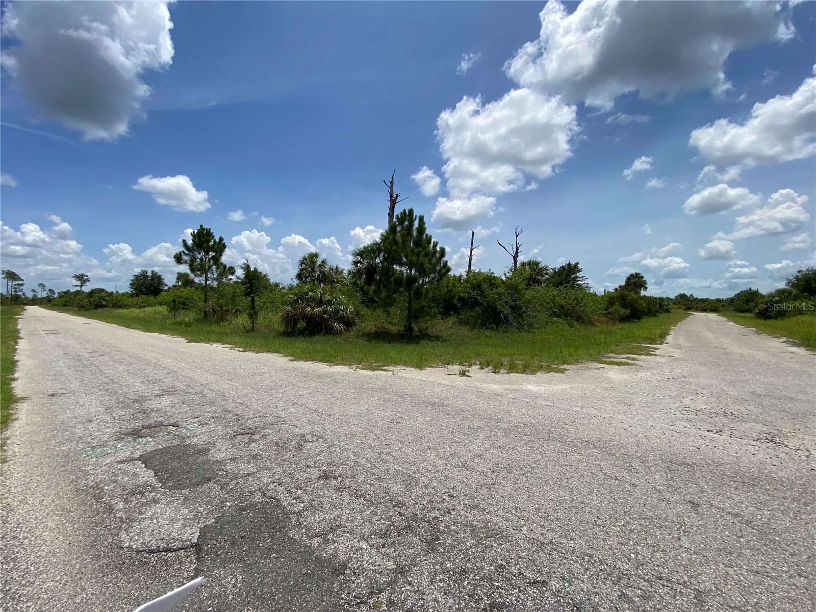 Exceptional Oversized Corner Lot in Booming North Port! Priced to Sell! Purchase to either build your next dream home or add this savvy property to your investment portfolio and invest in your future. North Port, Florida took the crown as the #1 Up and Coming Small City in the U.S. (MoneyGeek|May 2024) based on an increase in median household income and population, also winning a top spot as being one of the safest and most affordable cities in the US, additionally, North Port Florida had the #1 highest increase in home values NATIONWIDE, with a 33% jump from 2021 to 2022. Seize the opportunity to own a prime residential corner lot in the highly sought-after city of North Port. This tranquil, quiet and beautiful parcel has top rated schools, no HOA fees and no CDDs. North Port is nationally known as the Spring Training home of MLB's Atlanta Braves, featuring the awesome CoolToday Stadium Ball Park. Just minutes from I-75 and conveniently located between the vibrant cities of Sarasota and Fort Myers, North Port is an ideal base for exploring the spectacular Gulf Coast of Florida. This perfect location allows easy commuting while keeping you close to everything, some of Florida's best and most pristine beaches are within a short drive of North Port. With over sixty golf courses and accommodating weather year-round, Sarasota County is a swinger’s dream! This property is located minutes away from North Port's Warm Mineral Springs Park, where you can have a soak in the year-round 85 degrees mineral springs, which is thought to have one of the highest mineral concentrations of any natural spring in the U.S. Another of North Port’s unique natural wonders, the Myakka State Forest is one of the country’s only state forests that’s encompassed almost entirely within city limits. Explore the 8,500-acre flatwood and longleaf pine forest via its 40 miles of hiking, biking, and equestrian trails. Located in the heart of this vibrant city, is the state-of-the-art facility North Port Aquatic Center, a haven for water enthusiasts of all ages. North Port offers close proximity to renowned restaurants, world-class fishing, shopping destinations, and vibrant cultural attractions, you'll never have a shortage of entertainment options. Offering a perfect blend of nature, culture, and outdoor recreation, this growing city has something for everyone. Experience the best of both small-town charm and city-like perks! North Port is the place to be! Take a drive by today and make an offer for this incredibly priced and truly special oversized corner lot.