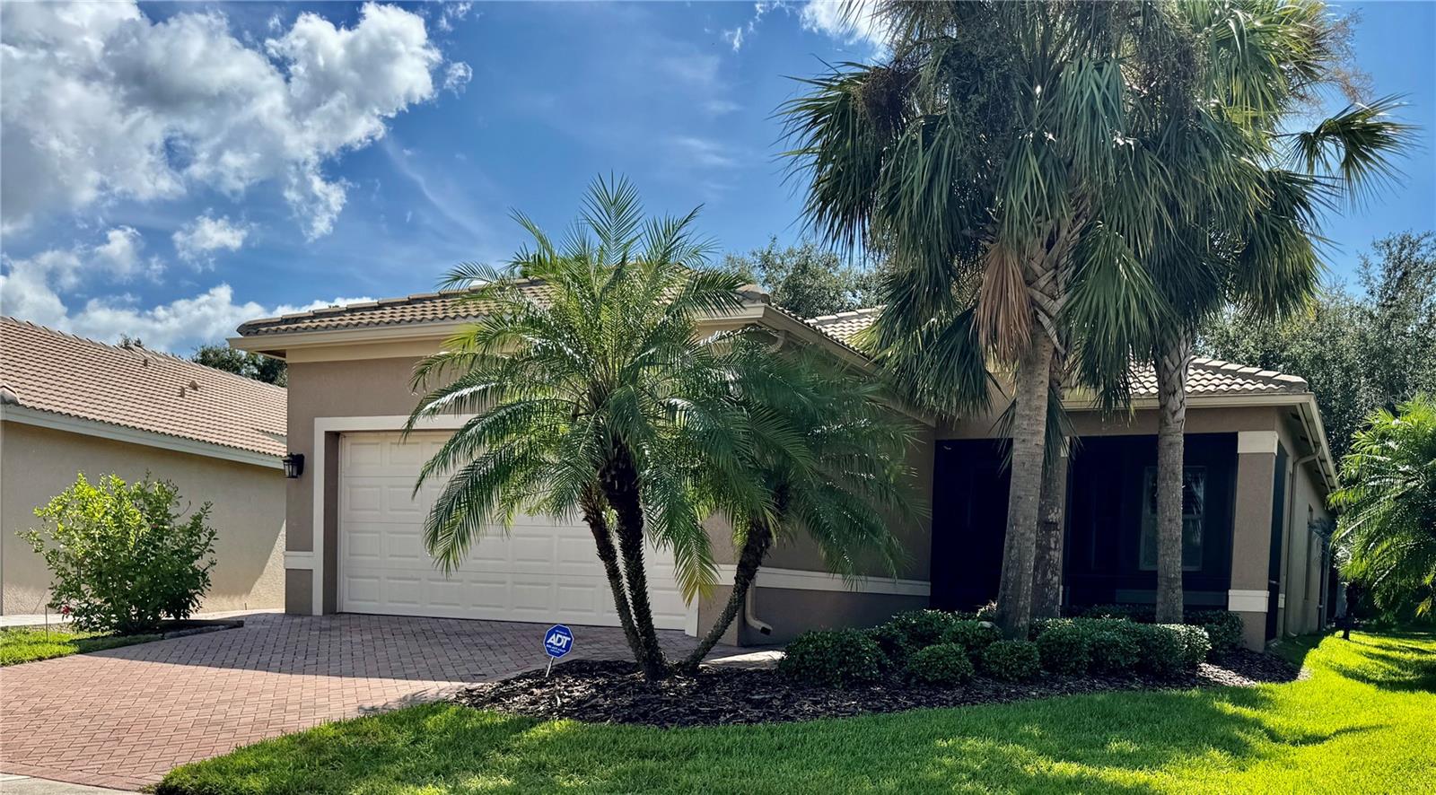 MAKE THIS HOUSE YOUR HOME! THERE IS SO MUCH TO APPRECIATE IN THIS 3 BEDROOM /2 BATH SINGLE FAMILY, LOCATED IN THE PREMIER 55+ VALENCIA LAKES NEIGHBORHOOD...STARTING WITH THE LARGE SCREENED ENTRY WAY, DOUBLE FRONT DOOR & 12' FOYER ENHANCED WITH COFFERED CEILING. LARGE TILE ON DIAGONAL THRUOUT AND PORCELAIN PLANK TILE IN TWO BEDROOMS INCLUDING ENSUITE MAIN BEDROOM THAT ALSO FEATURES 2 WALK-IN CLOSETS, GRANITE COUNTERTOPS, DUAL SINKS, SOAKING TUB & DECORATIVE TILED SEPARATE SHOWER W/ BENCH. KITCHEN OFFERS GRANITE COUNTERTOPS W/ PASS THRU TO DINING ROOM; PANTRY; BEAD BOARD CABINETS & BACKSPLASH; LARGE SINGLE BOWL STAINLESS STEEL SINK; FRENCH DOOR REFRIGERATOR/FREEZER & BOSCH DISHWASHER. BAY WINDOWS CREATE A COZY DINETTE AREA. TRIPLE SLIDING DOORS FROM LIVING ROOM LEAD OUT TO A SPACIOUS PRIVATE, SCREENED & COVERED LANAI WITH 4' EXTENDED PAVED PATIO. SPLIT BEDROOM PLAN SEPARATES SECOND BEDROOM & GUEST BATH. THIRD BEDROOM WITH DOUBLE DOOR ENTRY CAN SERVE AS OFFICE OR DEN. LAUNDRY ROOM HAS STORAGE CABINETS & STAINLESS STEEL UTILITY SINK. BEING SOLD "AS-IS", THIS COMFORTABLE CAPRI MODEL BOASTS NEWER A/C (2020) AND WATER HEATER (2023); PLANTATION SHUTTERS; 2 CAR GARAGE WITH EPOXY FLOORING; WHOLE HOUSE WATER SOFTENER SYSTEM; GUTTERS; PLUS ADDITIONAL PAVED WALKWAY UNDER HOSE BIB ON SIDE OF HOME FROM DRIVEWAY TO HELP KEEP THINGS CLEAN WHILE GARDENING OR CAR WASHING. LIVE IN PARADISE & ENJOY YOUR BEST FLORIDA LIFE WITH RESORT STYLE POOL; LAP POOL; RESISTANCE POOL & WHIRLPOOL. IF KEEPING BUSY IS YOUR THING, CHOOSE FROM A VARIETY OF CLUBS TO JOIN & GAMES TO PLAY IN THIS ACTIVE COMMUNITY. GETTING INVOLVED & MEETING YOUR NEIGHBORS WILL BE EASY & FUN! BEAUTIFUL CLUBHOUSE CONTAINS A LARGE STATE-OF-THE ART EXERCISE FACILITY TO STAY IN SHAPE, SOCIAL HALL FOR EVENTS, MOVIES, DANCES & HOLIDAY CELEBRATIONS; GAME ROOMS; ART STUDIO; BILLIARDS AND SO MUCH MORE! PLAY TENNIS; PICKLE BALL , SOFTBALL & BOCCE BALL! THERE'S ALSO A COMMUNITY GARDEN; DOG PARK & 2 MILE EXERCISE PATH AROUND THE COMMUNITY. THERE IS NO LACK OF THINGS TO DO IN VALENCIA LAKES!! GOLF CARTS WELCOME. CLOSE PROXIMITY TO DOWNTOWN TAMPA, SARASOTA, BEACHES & FLORIDA ATTRACTIONS. DON'T MISS OUT! THE PRICE IS RIGHT...CALL NOW FOR YOUR PERSONAL TOUR. ALL OFFERS WELCOME.