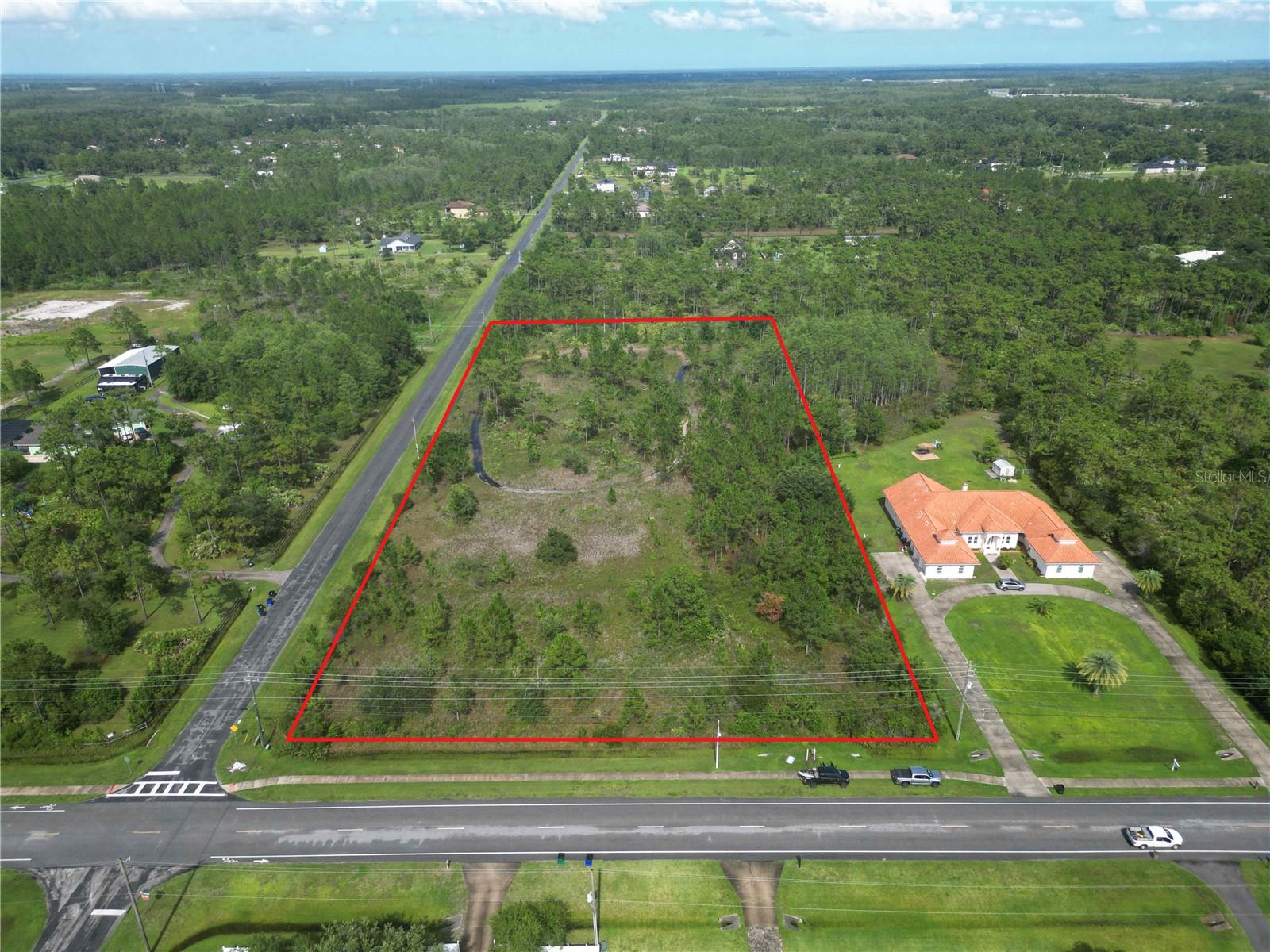 Come build your dream home on this 4.34-acre vacant lot in the desirable Wedgefield community. This buildable property features two concrete culverts already installed—one on Bancroft Blvd and one on Sabal Street—offering convenient access for the future owner. Enjoy the option of a low $50 annual HOA membership and the benefit of a K-8 school established in 2016 right within the community. Located near Wedgefield Park, Wedgefield Golf Club, and major roadways like 528 and 520, you’ll have quick access to shops, restaurants, and beaches. This is a rare opportunity to set down roots in one of East Orlando’s premier neighborhoods. Building plans and CAD files are available for reference to help bring your vision to life.