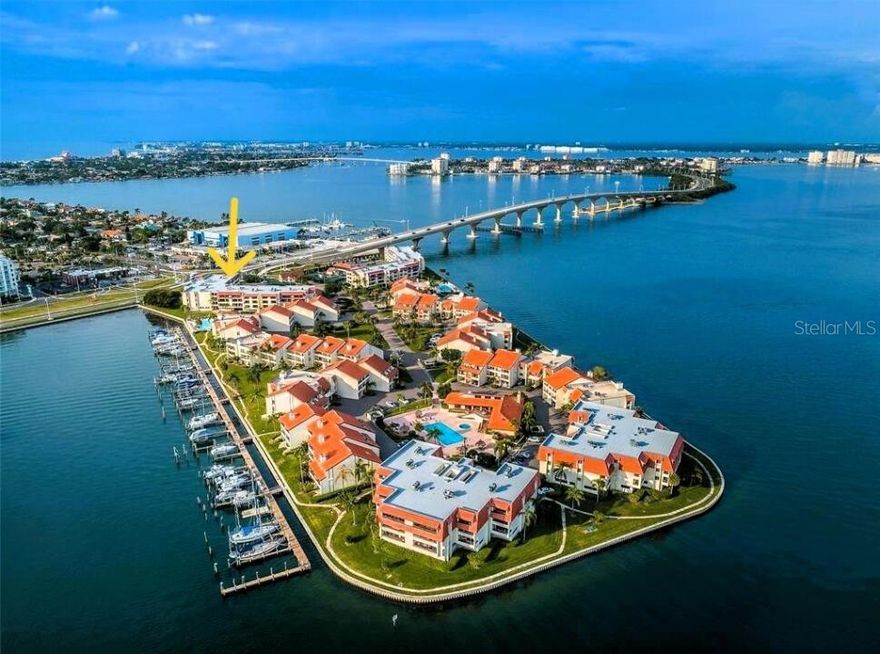 One or more photo(s) has been virtually staged. Explore effortless luxury in the Village at Tierra Verde, nestled on it's own gated 24/7 guard-secured waterfront peninsula; featuring amazing azure views and protective barrier islands. Take an elevator to the thoughtfully renovated 3rd story aerie with an open split bedroom floor plan and abundant natural light sunrise to sunset. The first of three scenic pools, spas, and lighted tennis courts, not to mention the private marina, are merely steps from this well built retreat. The deeded parking space and large deeded storage/workshop area are sheltered beneath, surrounded by reinforced concrete and proven superior construction. Enjoy the fully updated turnkey unit enhanced by extensive granite counters, plentiful coordinated hardwood cabinetry, contemporary neutral color palette, two dining bars, lifetime warranted stone composite floors, spacious rooms, and a 20 foot balcony with storage, partial water views and spectacular sunsets. Conveniently located minutes from renowned beaches, parks, crave-worthy local dining, and eclectic shopping. Minutes to I-275, St Pete, Tampa, Sarasota. Experience lock and leave freedom and coastal living at its finest in this desirable location! KEY FEATURES: 24/7 GATED and Guard SECURED private peninsula - 3 Heated/Chilled POOLS with SPAS - 3 Lighted TENNIS Courts - ELEVATOR - 47 slip MARINA (sales/rentals) - PET and MOTORCYCLE FRIENDLY - DEEDED PARKING under bldg, GROCERY CARTS provided - DEEDED 10-ft (320 sq ft mol) STORAGE/WORKSHOP room with electric - INTERIOR LAUNDRY with FULL-SIZE washer/dryer - FITNESS CENTER with SAUNAS - CLUBHOUSE with Kitchen, Meeting room, Library, Billiards - Full HURRICANE SHUTTERS - WATERFRONT BOARDWALK/FISHING - HOA INCLUDES: GUARDS, ONSITE MANAGER, Spectrum Premium CABLE, Hi Speed INTERNET, WiFi, WATER, TRASH, SEWER, LANDSCAPING, all EXTERIOR MAINTENANCE & INSURANCE, and Full COMMUNITY AMENITY UPKEEP - WELL RUN responsive HOA, FULLY FUNDED RESERVES, MILESTONE STRUCTURAL INSPECTION UPDATED LAST WEEK (A+).  Low-maintenance coastal living at its best!
