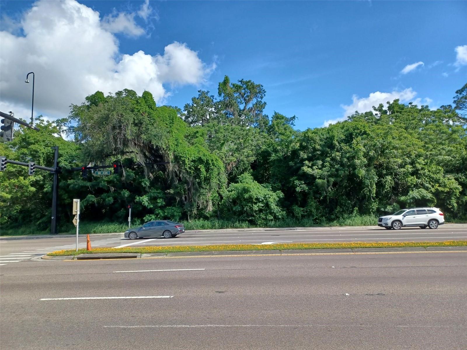 Wow almost 700 feet fronting State Rd 434, This land is ideally located, close to I-4 and can be developed into Office Park, Retail or maybe Residential Meeting with county asap to determine uses additional .58 acres available