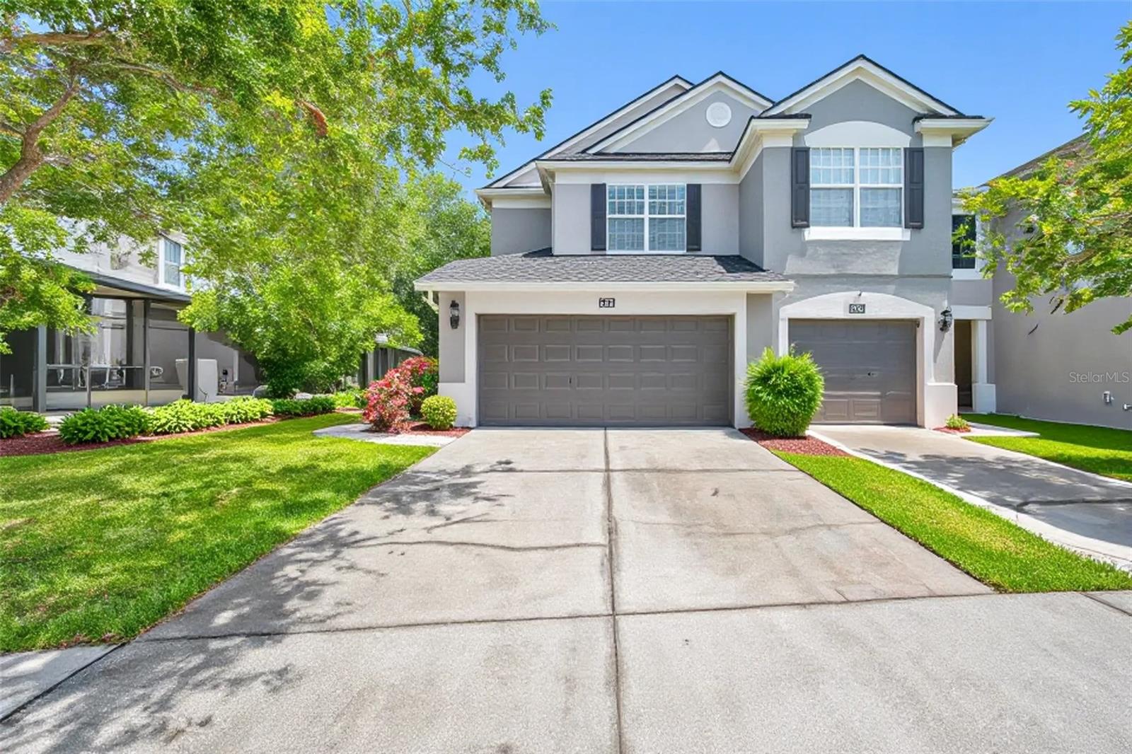 One or more photo(s) has been virtually staged. This rare corner-unit townhome is a standout in the gated community of Westpark Preserve. Featuring 3 bedrooms, 2.5 bathrooms, and a spacious 2-car garage, this well-maintained home combines style, comfort, and convenience. As an end unit, it enjoys extra windows throughout, filling the space with abundant natural light and enhancing the open, airy atmosphere.The kitchen and primary bathroom have been upgraded with beautiful, thick granite countertops and sleek undermount sinks, offering a touch of luxury to everyday living. Additional recent improvements include brand new stainless steel Whirlpool appliances, a newer Lennox AC system, new water heater, and fresh interior paint throughout. All wet areas feature durable tile flooring, and ceiling fans have been installed in every room for year-round comfort. Rich wood flooring accents the main living and dining areas, and sliding glass doors off the family room lead to a private screened-in patio overlooking peaceful wooded greenery—perfect for relaxing or entertaining. Upstairs, three generously sized bedrooms provide flexible space for family, guests, or a home office. Westpark Preserve is a gated, manicured community offering residents access to a gorgeous pool and recreational area. Rent includes services such as water/sewer, internet, cable, trash, landscaping and gated entry. Ideally located near the Veterans Expressway and Linebaugh Avenue, you'll enjoy quick access to shopping, dining, and all that Tampa Bay has to offer!
