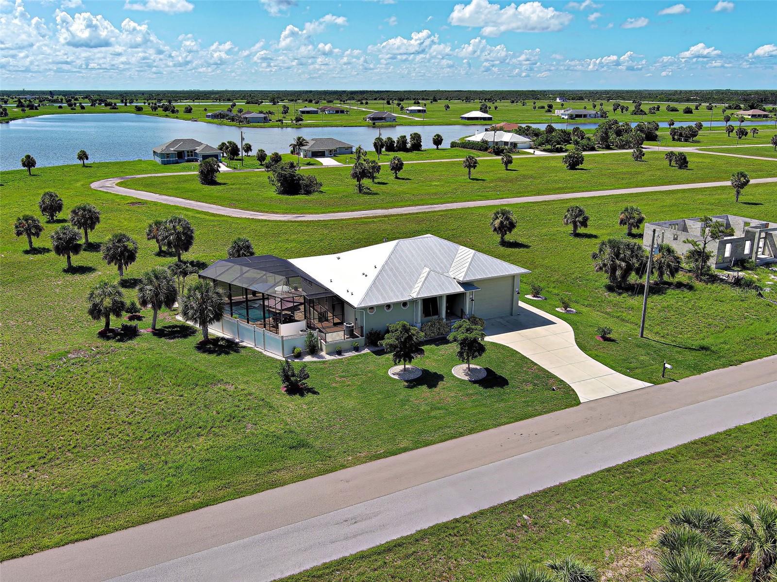 RV, Boat or a car enthusiast garage storage...check, check, check! You'll love the massive 1,000 sq ft RV garage equipped with full water, electric and sewer hookups, plus convenient loft storage and an additional garage door in the back. Front Garage door measures 15' wide and 13'2" tall. Say goodbye to storage fees and hello to convenience. Boca Grande public boat ramp is just 5 minutes away!
Tucked away in the peaceful Rotonda Villas and Meadows community offers the perfect blend of
comfort, location and Florida charm.
Custom built in 2017 by the owner-a skilled contractor with an eye for detail. This home has been thoughtfully designed to meet all your needs and meticulously executed. Step inside to a spacious and welcoming layout featuring 2 bedrooms and 2 bathrooms. The guest suite has its own private entrance and direct access to the pool-ideal for the privacy of guests, in-laws and/or extended family. It can be available as turnkey fully furnished, a great option for convenience.
Impact resistant hurricane windows provide peace of mind and eliminate the need for shutters. The home has an elevated finished floor at an elevated height of 11.3. No flooding has ever been here!
The light filled gourmet kitchen has a wall of windows and opens to the living and dining areas, creating a seamless space for entertaining. There is an installed ice maker and microwave in the kitchen island and has hot and cold water lines and 2” drain for a possible island sink. The home's design effortlessly blends indoor and outdoor living, highlighted by an expansive resort-style heated pool, expanded lanai and an impressive outdoor kitchen, perfect for year-round enjoyment. Storage is abundant with oversized closets, inside laundry and thoughtfully designed nooks throughout. This home is so clean and has been immaculately maintained. Whether you're looking for a sunny escape, a full-time residence or the ideal home base while traveling the world, this home delivers it all with style and function and fun.
Pack up the suitcase with your swimsuit, flamingo floatie, and get ready to yell "Cannonbaaaaallll"!