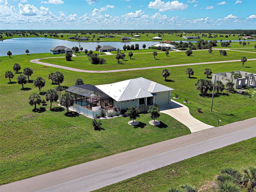 RV, Boat or a car enthusiast garage storage...check, check, check! You'll love the massive 1,000 sq ft RV garage equipped with full water, electric and sewer hookups, plus convenient loft storage and an additional garage door in the back. Front Garage door measures 15' wide and 13'2" tall. Say goodbye to storage fees and hello to convenience. Boca Grande public boat ramp is just 5 minutes away! 
Tucked away in the peaceful Rotonda Villas and Meadows community offers the perfect blend of 
comfort, location and Florida charm. 
Custom built in 2017 by the owner-a skilled contractor with an eye for detail. This home has been thoughtfully designed to meet all your needs and meticulously executed. Step inside to a spacious and welcoming layout featuring 2 bedrooms and 2 bathrooms. The guest suite has its own private entrance and direct access to the pool-ideal for the privacy of guests, in-laws and/or extended family. It can be available as turnkey fully furnished, a great option for convenience. 
Impact resistant hurricane windows provide peace of mind and eliminate the need for shutters. The home has an elevated finished floor at an elevated height of 11.3. No flooding has ever been here! 
The light filled gourmet kitchen has a wall of windows and opens to the living and dining areas, creating a seamless space for entertaining. There is an installed ice maker and microwave in the kitchen island and has hot and cold water lines and 2” drain for a possible island sink. The home's design effortlessly blends indoor and outdoor living, highlighted by an expansive resort-style heated pool, expanded lanai and an impressive outdoor kitchen, perfect for year-round enjoyment. Storage is abundant with oversized closets, inside laundry and thoughtfully designed nooks throughout. This home is so clean and has been immaculately maintained. Whether you're looking for a sunny escape, a full-time residence or the ideal home base while traveling the world, this home delivers it all with style and function and fun. 
Pack up the suitcase with your swimsuit, flamingo floatie, and get ready to yell "Cannonbaaaaallll"!