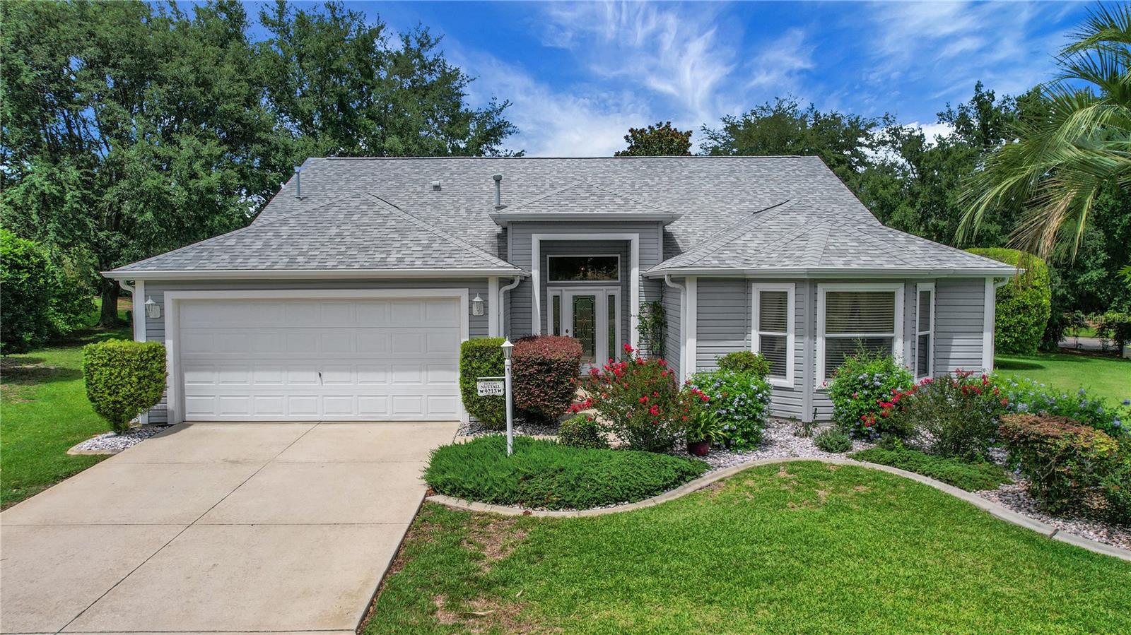 Tucked away on a peaceful cul-de-sac in the highly desirable Briar Meadow neighborhood, one of the best-kept secrets in The Villages, this BOND PAID 1900+ sq ft heated Crepe Myrtle Designer home on an oversized lot (.29 acre with room for a pool) offers both comfort and convenience. Inside, you’ll find high ceilings and a spacious laundry room with ample storage and an area for a desk. The kitchen features a breakfast bar, perfect for casual dining or entertaining. The primary suite includes a bathroom with double sinks, a toilet closet for privacy, and a walk in shower. Enjoy peace of mind with major updates already completed: ROOF replaced 12/20, HVAC changed out in 2020, and water heater installed in 2013. This home also features both gas and electric utilities. Step outside to a large PRIVATE yard with an extended screened lanai, ideal for relaxing or hosting guests. This home is just a short golf cart ride to Nancy Lopez and Glenview Country Clubs, several community pools, and the Mulberry Grove Recreation Center and plaza. Nearby amenities include shopping, restaurants, banking, and the VA Center — everything you need just moments away. Call today for your private showing!!