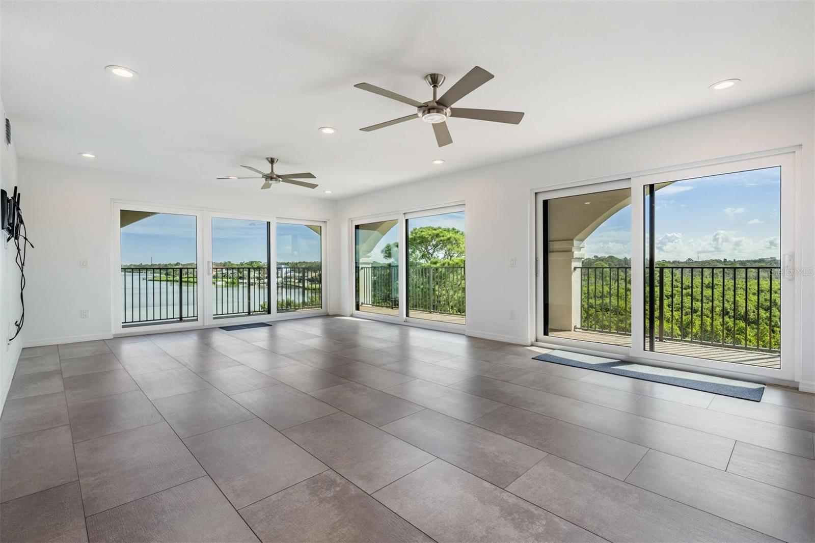 What do you get with this panoramic view of the Gulf, looking out at Howard Park and Sunset Beach? PENTHOUSE! What was two top floor units is now a true 4 bedroom/4 bath condo on the top floor, fully gutted down to the cinder blocks and renovated with new electrical, plumbing, 8 sliders, 2 windows, insulation and walls. This renovation included adjustments to the floor plan to allow for maximum spacing and views from each room. Spacious kitchen with large island (Blue Pearl granite) easily fitting 5-6 stools, with a large dining room capable of seating 25 people, and views of the preserve and mangroves (this area can never be built on). A sitting area with access to the balcony with the first of three (3) 6x6 air conditioned closets on the balconies. Porcelain 2x4 tiles and high quality laminate flooring throughout. A master bedroom with access to the balcony, two closets, a large bathroom with granite countertops, double vanity, and a walk in shower. Bedroom 2 is large and has amazing views of the mangrove/preserve with a bird sanctuary. Bedroom 3 has access to the 50 foot wrap around the balcony where you will find 2 more air conditioned 6x6 closets. Bedroom 4 - seen as an office, is a large bedroom with an on-suite bathroom and amazing views. Boat slips are available at neighboring Tarpon Cove! Milestone inspections have been completed and passed. The reports are available upon request.
Don't miss out on a community packed with social activities and events! Organized tennis, pickleball and bocce ball. Activities are posted on all bulletin boards. There you will find calendar events such as Luau by the Pool, clubhouse parties with DJs and bands, the Annual Art Show and Community Photo Contest, just to name a few! The kayak launch is located just behind this building where you can head to the mangroves and see the bird sanctuary or head to Sunset Beach or Howard Park beach. All can be seen from your balconies. If you have
a boat, lease a boat slip at the community marina, take a last minute sunset ride or daytime rides to the islands. No canal to deal with, direct gulf access awaits you!